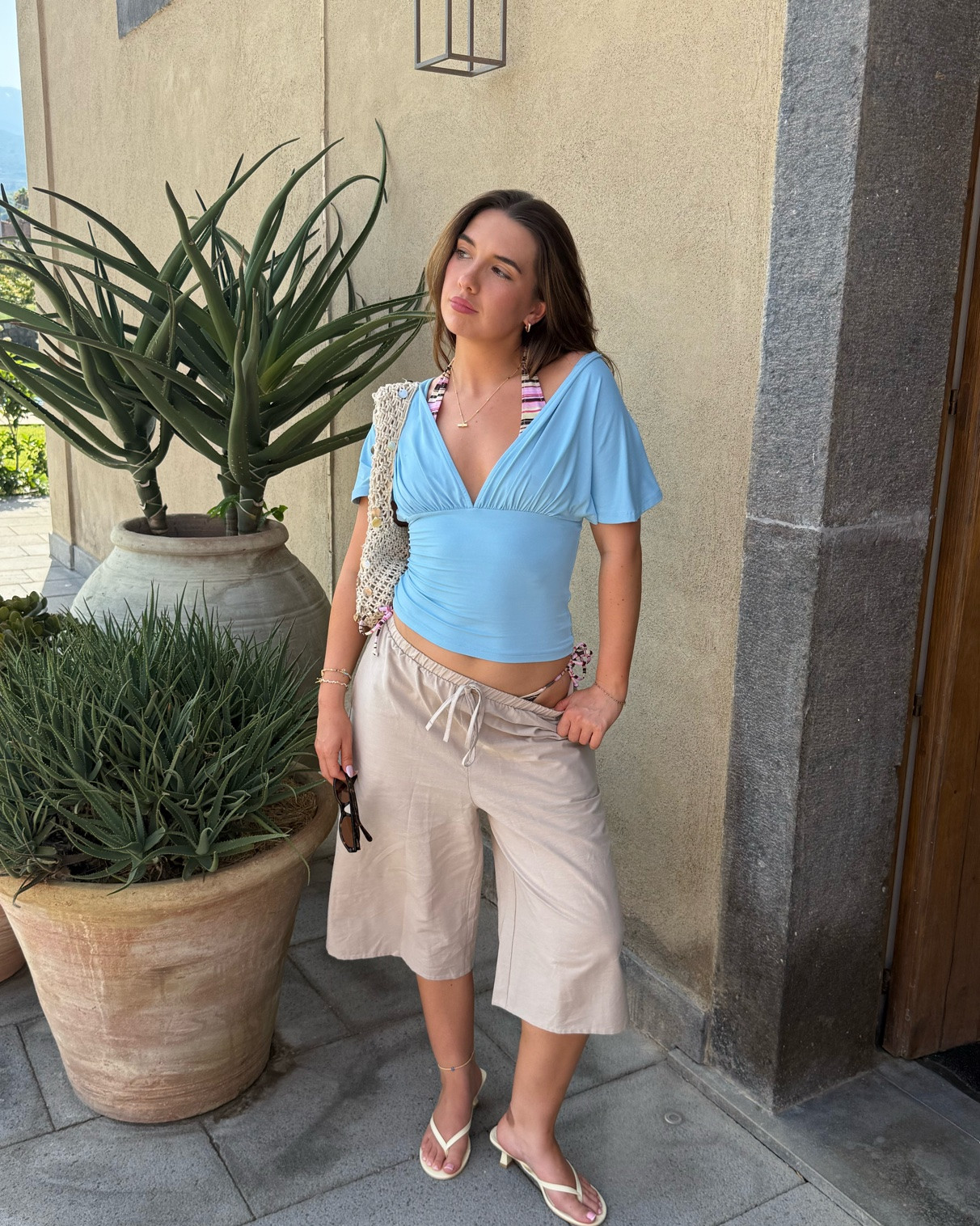 Euro summer holiday chill outfit 
Cotton shorts 
Blue top 
Yellow heels 
Yellow flip flops 
Shell bag 
Striped bikini

#LTKsummer #LTKuk