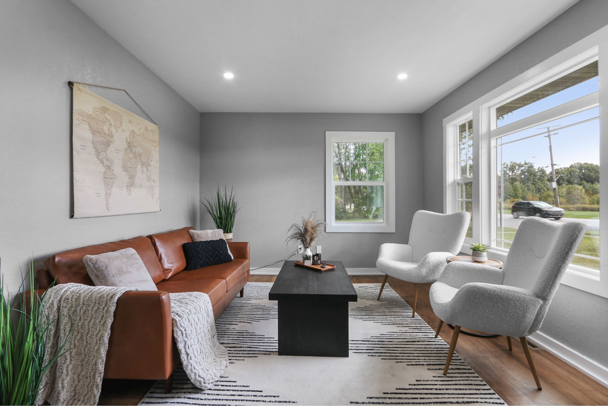 Staging this living room made such a difference!! The faux leather sofa brought color while still keeping an overall neutral palette. I love this one specifically, easy to put together, great color and reasonable price, but I’ve linked several options. Also, these chairs look so much pricier than they are! ✨

#LTKfindsunder100 #LTKsalealert #LTKhome