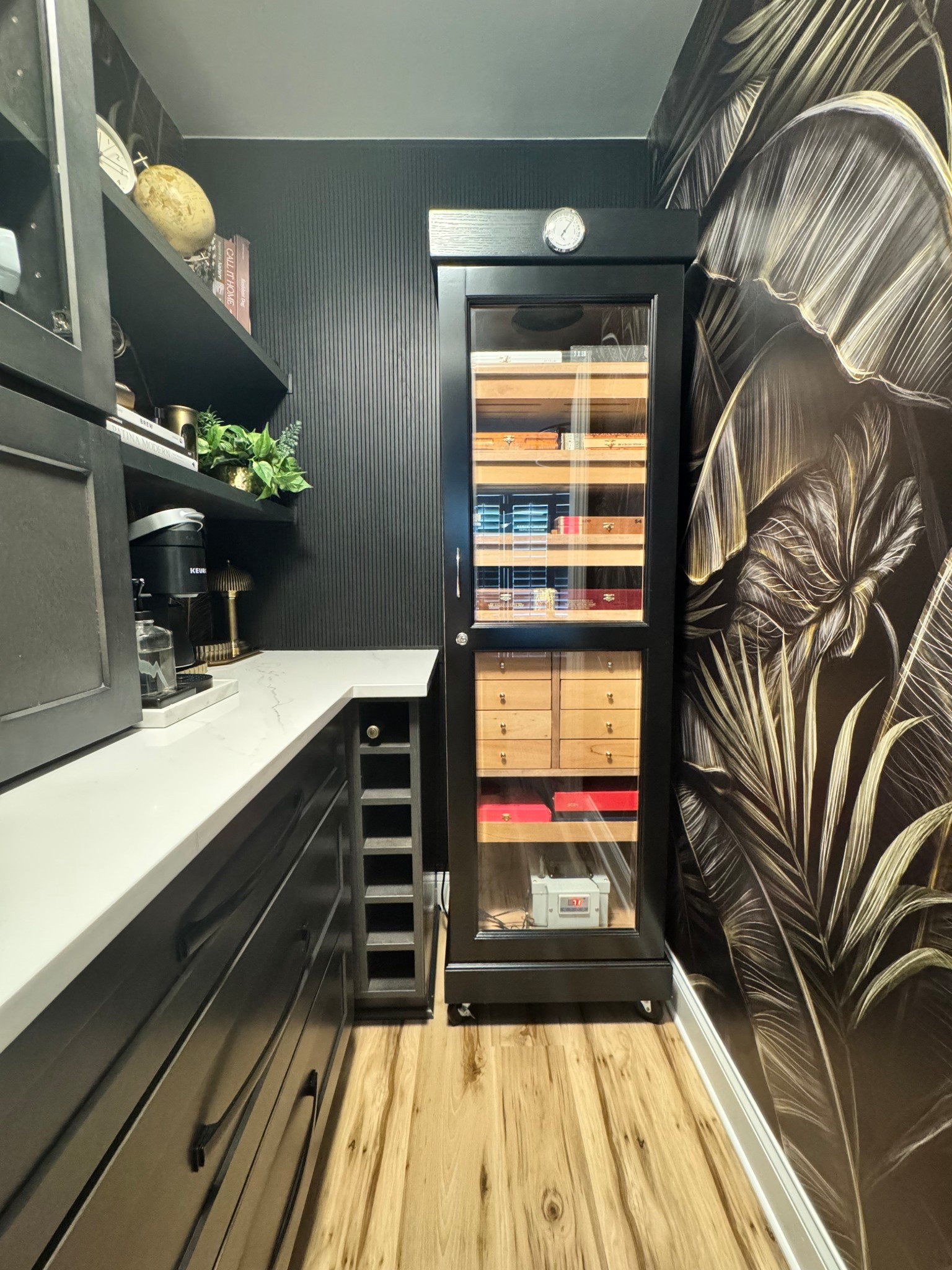 From Forgotten Closet to Luxe Coffee & Cigar Escape

A bold transformation with some thoughtful design moves.

This once-unused closet got a serious glow-up—now a sleek coffee & cigar bar with custom shelving, warm lighting, and luxe textures.

Used pole-wrap to conceal wall flaws and add texture. Two coats of Tricorn Black by Sherwin Williams brought the drama.

#LTKHome