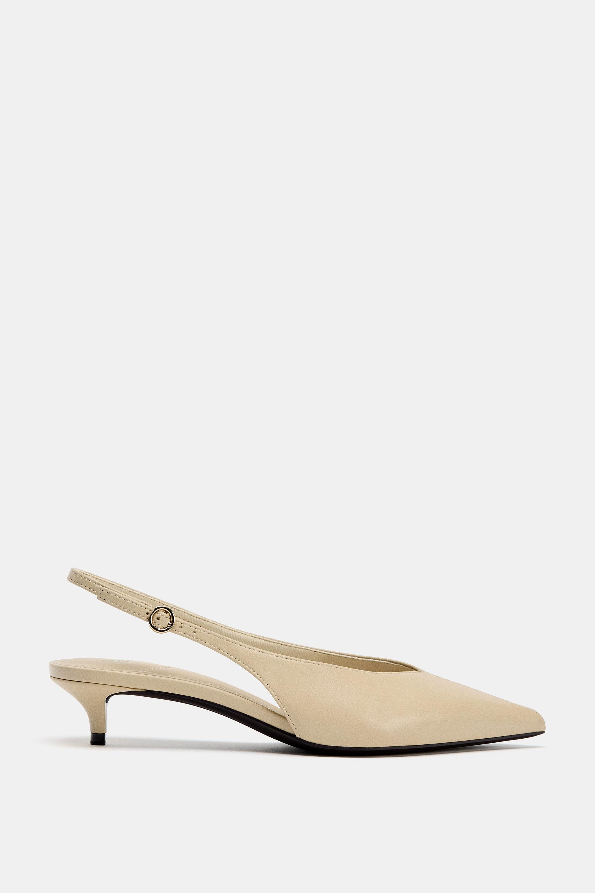 Slingback heels. Topstitching on the front. Back strap with metal buckle. Thin kitten heel. Point... | Zara US