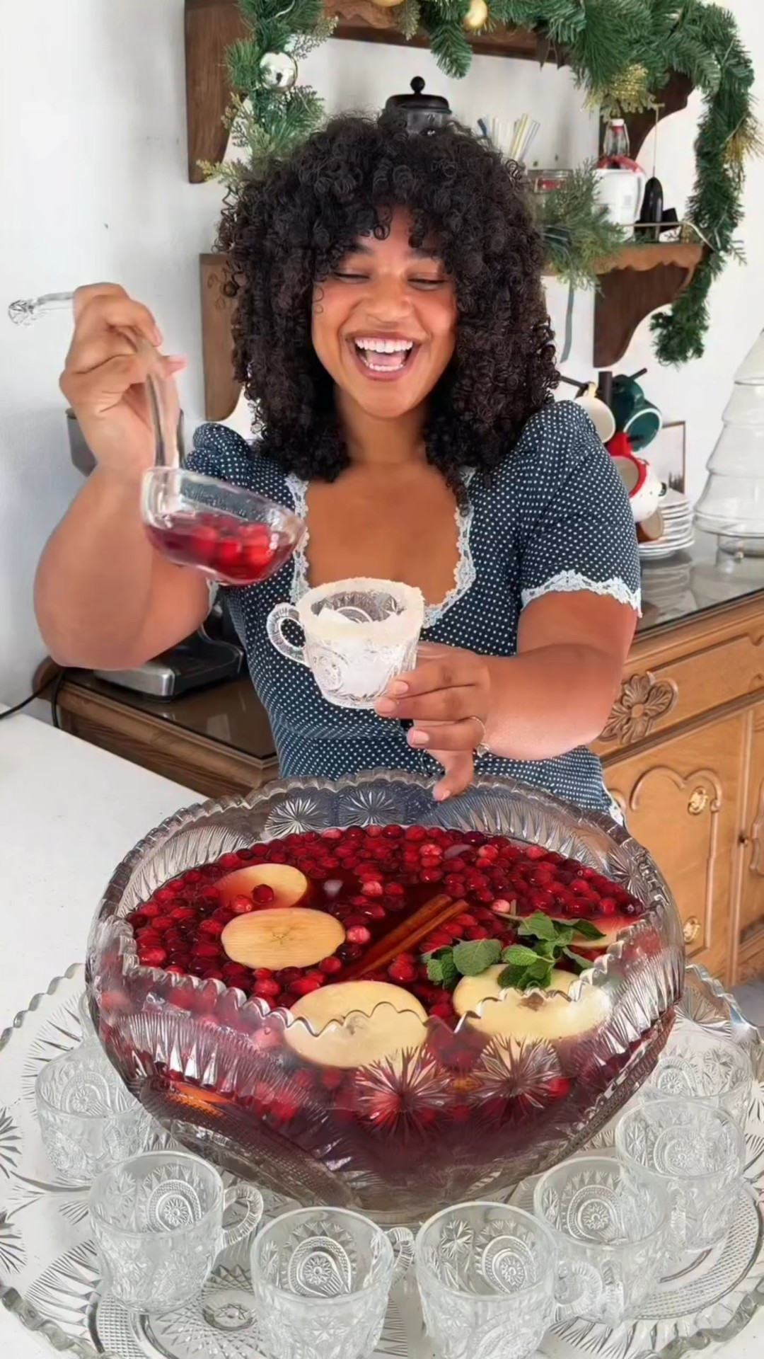 Holiday punch recipe below or comment “recipe” and I’ll send it to your dms!! Can’t wait to serve this during our first time hosting during the holidays🎄 I’ve been really excited to build traditions and make our house feel like a home. I’m slowly learning to take it slow and allow myself to be seen trying! 🤍 
Apple juice and cranberry juice to your liking!! If you don’t want it to be super strong add more juice. I did half a bottle of each! 

- 1 Bottle prosecco 
- 1 bottle pinot noir 
- 1 cup vodka
- add your mint, apple slices, orange slices, edible glitter, and cranberries to garnish! Serve with a cup frosted in sugar!! ✨🤍🎄 #holidaypunch #jinglejuice #christmaspunch #holidaydrinks last minute holiday punch