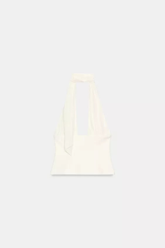 Halter neck top with a pronounced V-neck. Featuring a foulard-style tied detail and a matching li... | Zara UK