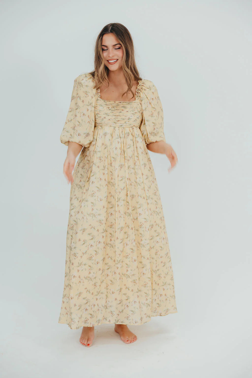 Melody Maxi Dress with Pleats and Bow Detail in Yellow Floral - Bump F | Worth Collective