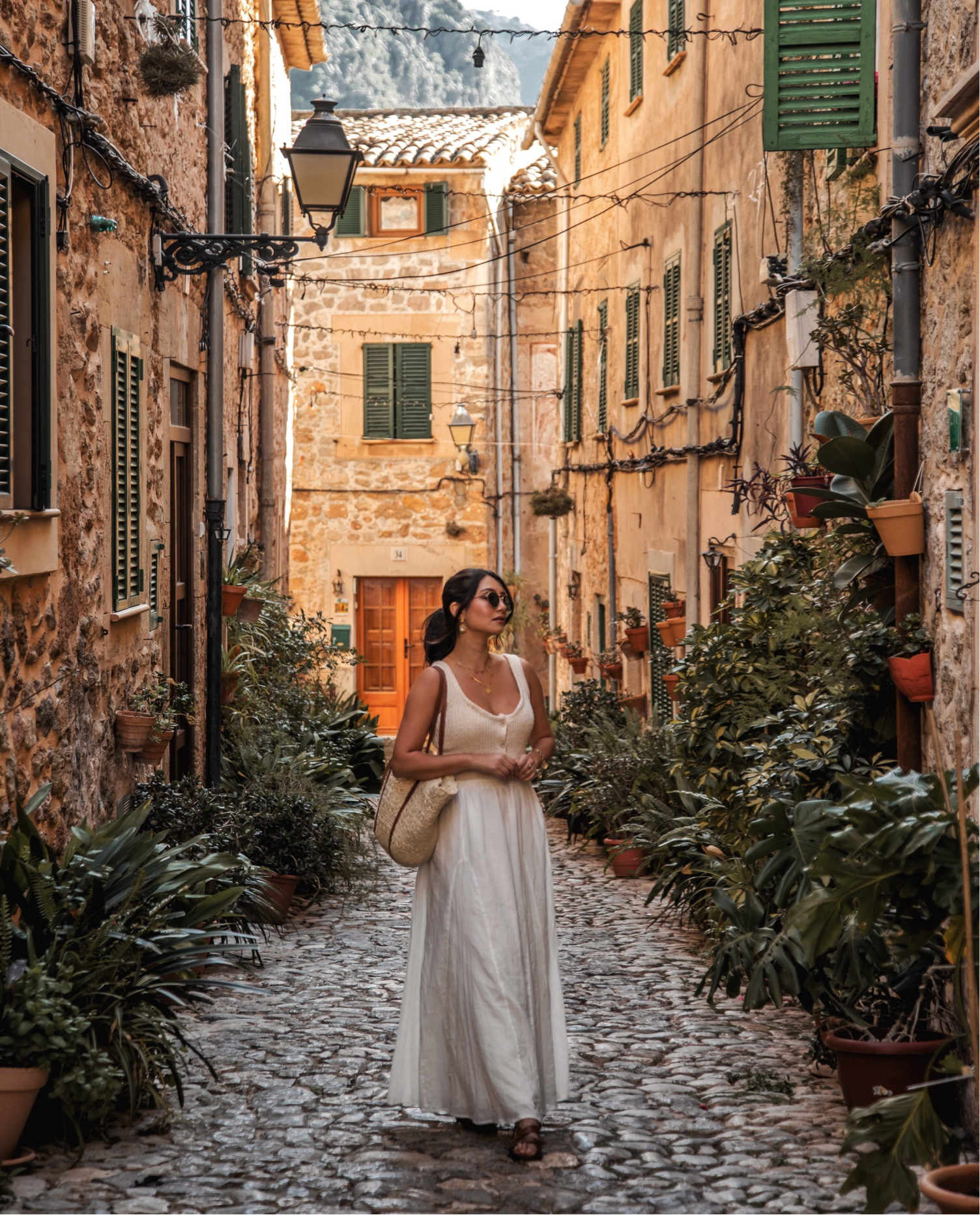 My go to casual summer outfit featuring the perfect white maxi skirt and my staple accessories 