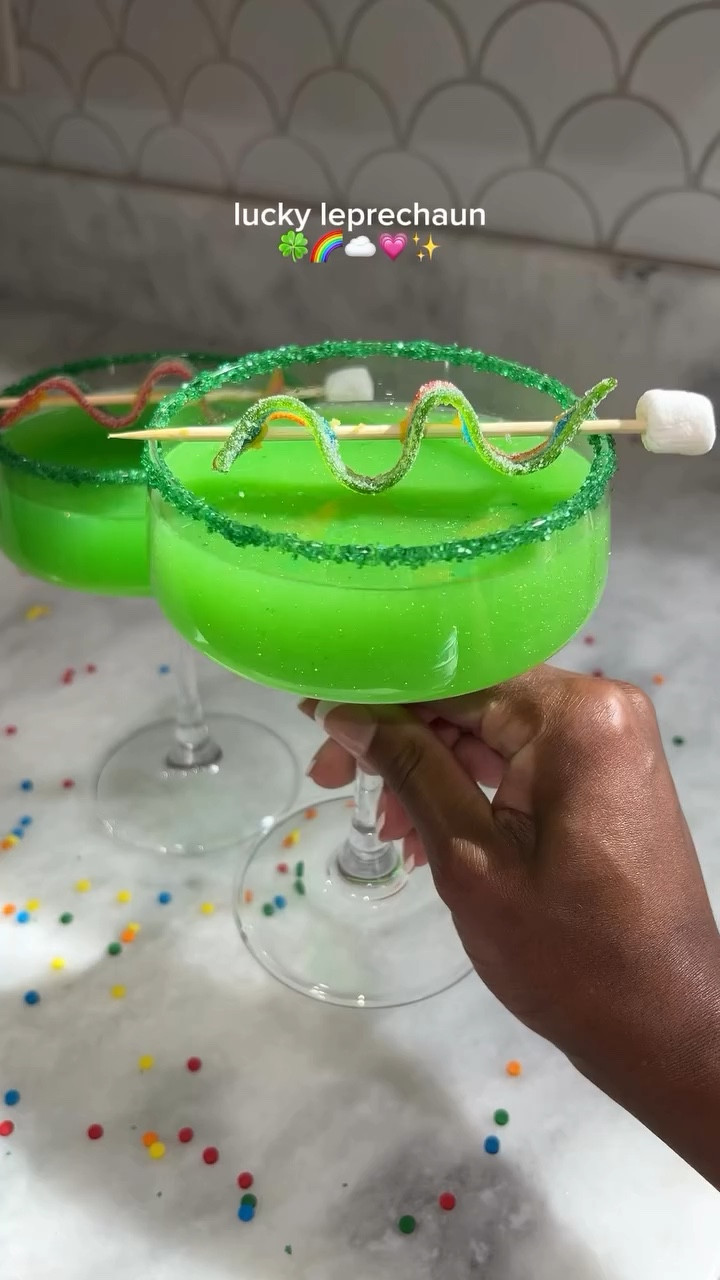 let’s sip and get lucky! 🍀🌈💗✨

INGREDIENTS
* 2 oz rum
* 1/4 oz simple syrup
* 1 3/4 oz simply lemonade
* blue raspberry lemonade koolaid
* green sanding sugar
* Optional: green or gold edible glitter

DIRECTIONS 
1.  Brush the rim of your glass with a lime, then dip onto a plate with green sanding sugar.
2. Add ice, rum , lemonade, simple syrup, koolaid, and edible glitter to a cocktail shaker. Shake until chilled.
3. Strain into your prepped glass
4. Garnish with a rainbow candy strip and enjoy! 
♡
♡
♡
#stpatricksday #shamrock #greendrink #stpaddysday #glitter #luckycharms #EasyRecipes #fyp #tiktokban #momtok #blackgirltiktok #fyp #girlsnight #sahm #fypシ #stpattys #stpatricks #happystpatricksday #stpaddysdrink #stpatricksdaydrinks #stpattysdrink #drinktok #drinkideas #drinkrecipe #drinksoftiktok #stpaddys #stpatricksdaydrink