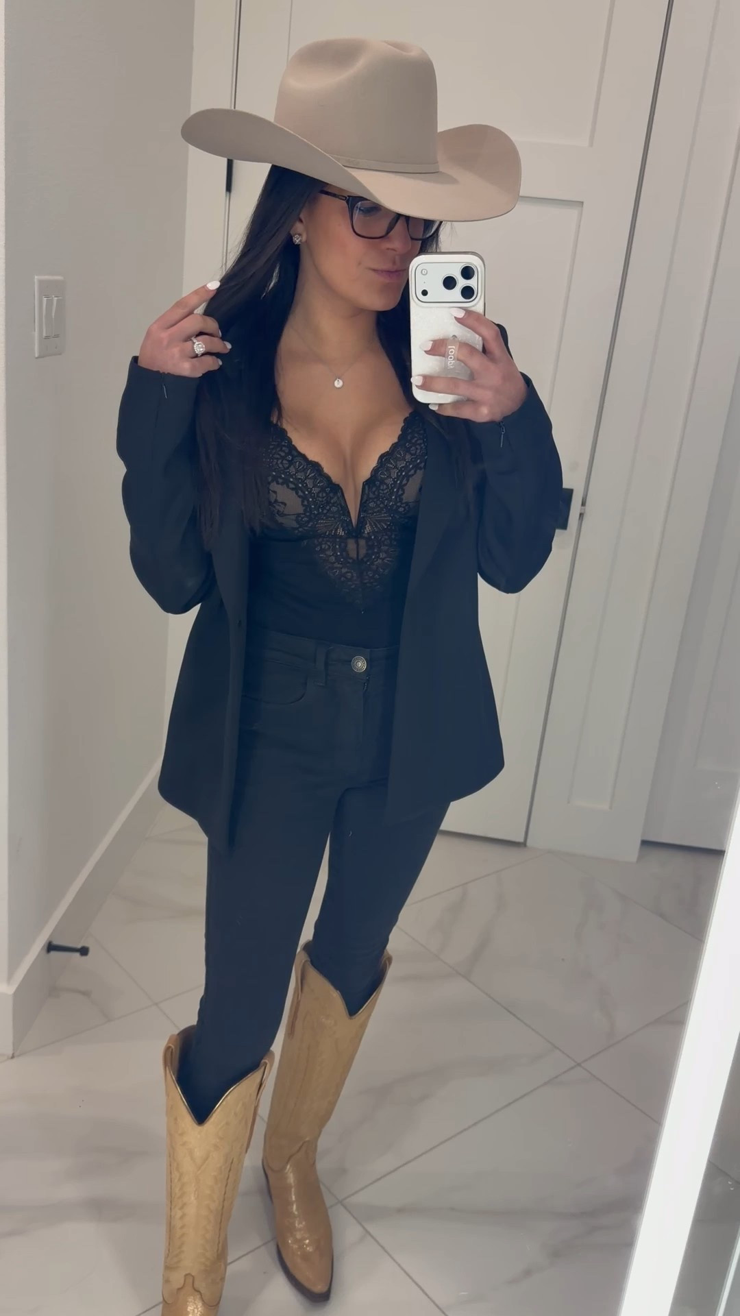 Wearing the Lucchese Priscilla champagne shimmer boots with a Stetson silver belly hat and an all-black base — lace romper layered under a structured blazer for that perfect mix of edgy and elevated.

This is the ultimate country concert outfit. Comfortable enough to stand, dance, and walk the venue — but bold enough to turn heads the second you step into the crowd. The shimmer boots catch the stage lights, the blazer keeps it polished, and the lace adds just the right amount of feminine detail.

#LTKstyle #LTKfinds #ConcertOutfit #CountryConcertStyle #WesternGlam #LuccheseBoots #StetsonHat #CowgirlStyle #FestivalOutfit #NashvilleStyle #AllBlackOutfit #WomensFashion @Lucchese Bootmaker 

#LTKootd #LTKPetite #LTKmomlife