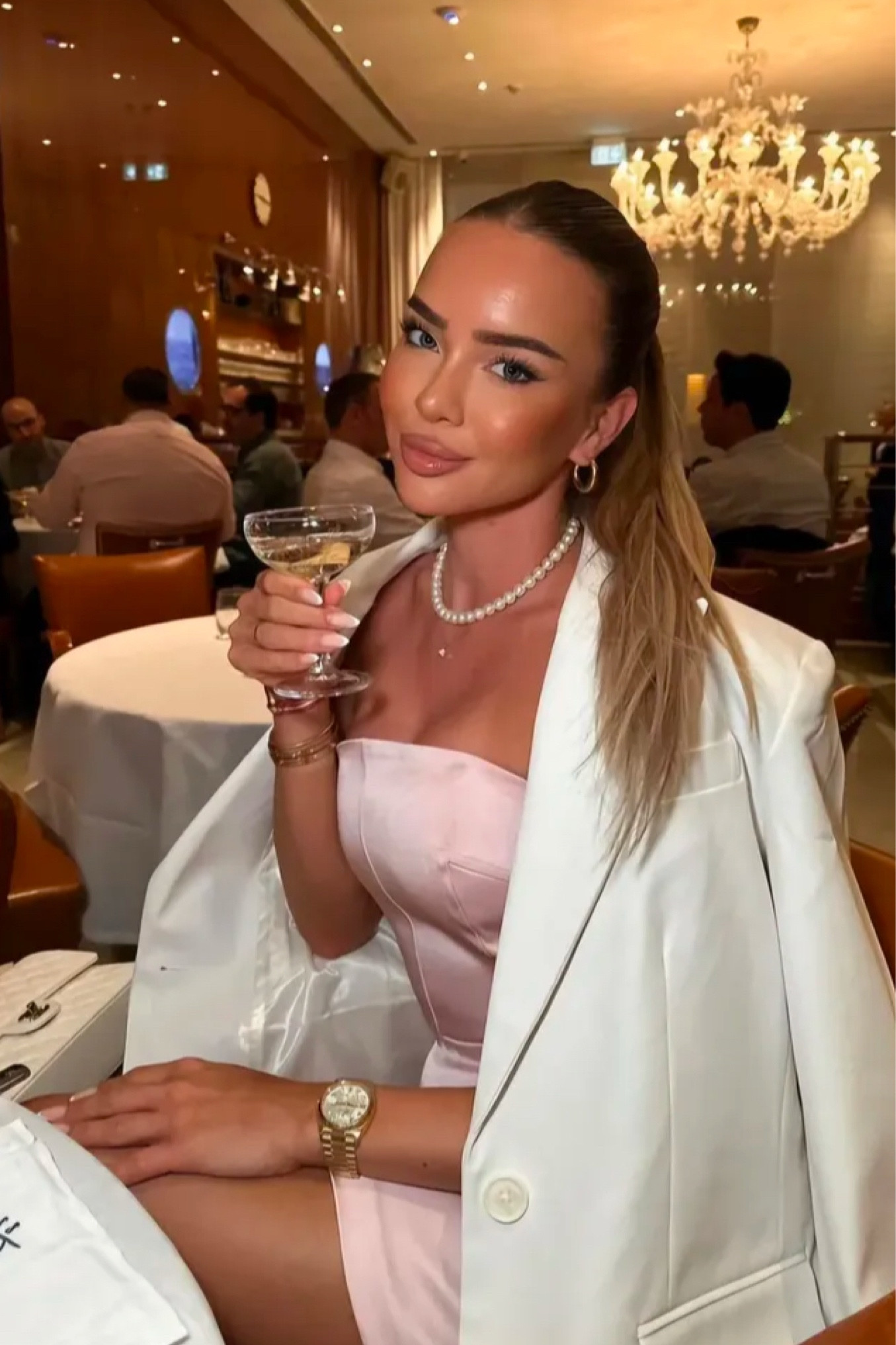 Pink silk  strapless dress 
Pearl necklace 
White blazer
Gold watch 

#LTKPetite #LTKMostLoved #LTKStyleTip