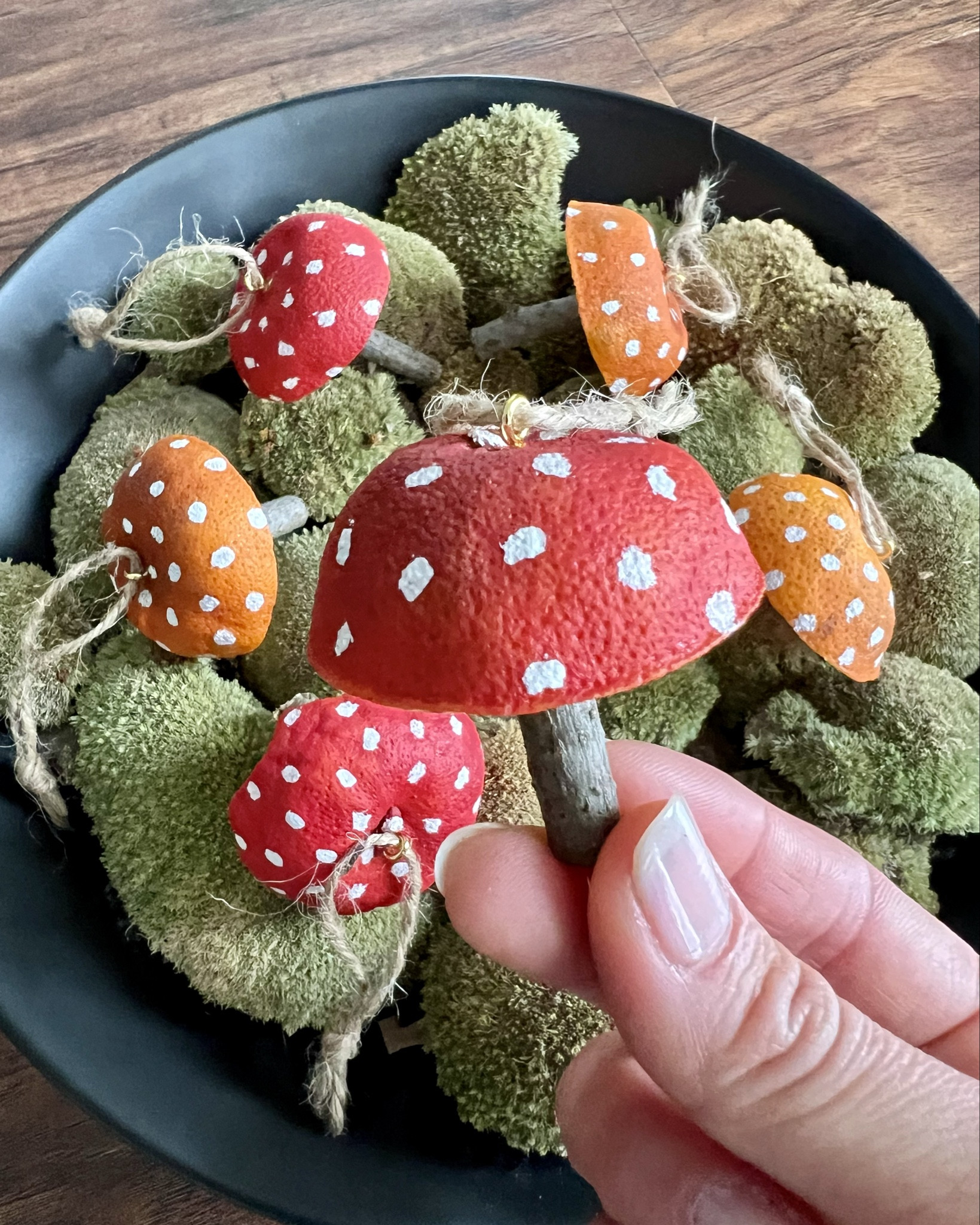 Mushroom ornaments made of dried orange peel. 
Hang them on your Christmas tree, wreath, center piece or use them as gift topper. 
Since mushrooms are seen as good luck and good fortune they make the perfect gift and keep them in your home for good luck.

#LTKHome #LTKStyleTip #LTKFamily