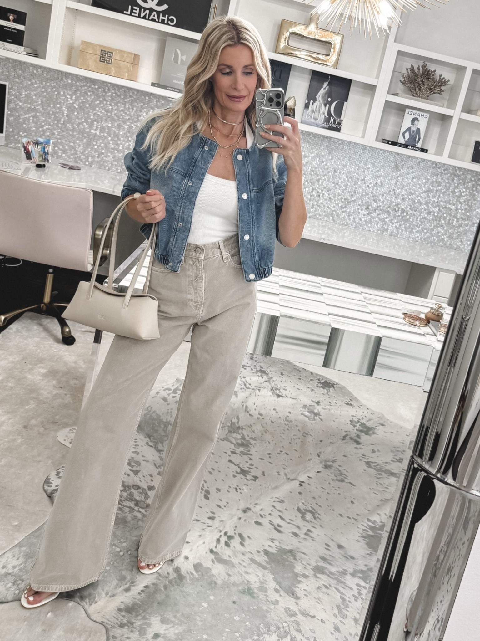 New Reformation jeans styled for an easy casual outfit of the day! These high-waisted wide-leg jeans are comfortable, flattering, and so versatile in this beige denim shade. I paired them with a white halter top and denim bomber jacket for a polished everyday look. I’m wearing a size 24 in the jeans. #NewJeans #ReformationStyle #WideLegDenim #LTKOver40 

 #LTKootd #LTKSeasonal #LTKOver40