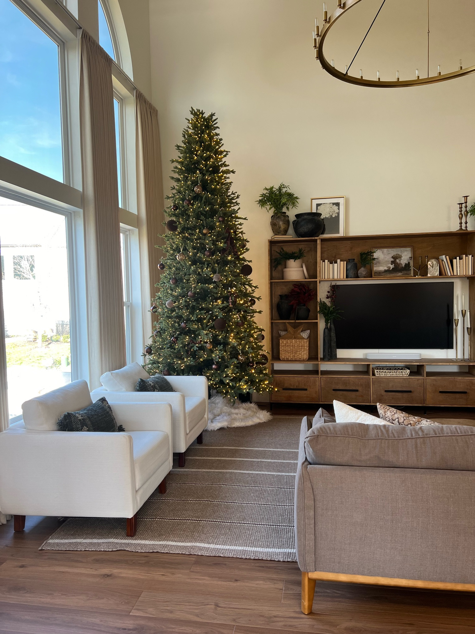 Living room inspo 

The Christmas tree is actually the Costco one if you can snag that… But it’s $100 more than the one I linked and looks virtually the same!

The white chairs were from a company that went out of business and the entertainment center we built! 

#LTKHome #LTKSeasonal #LTKHoliday