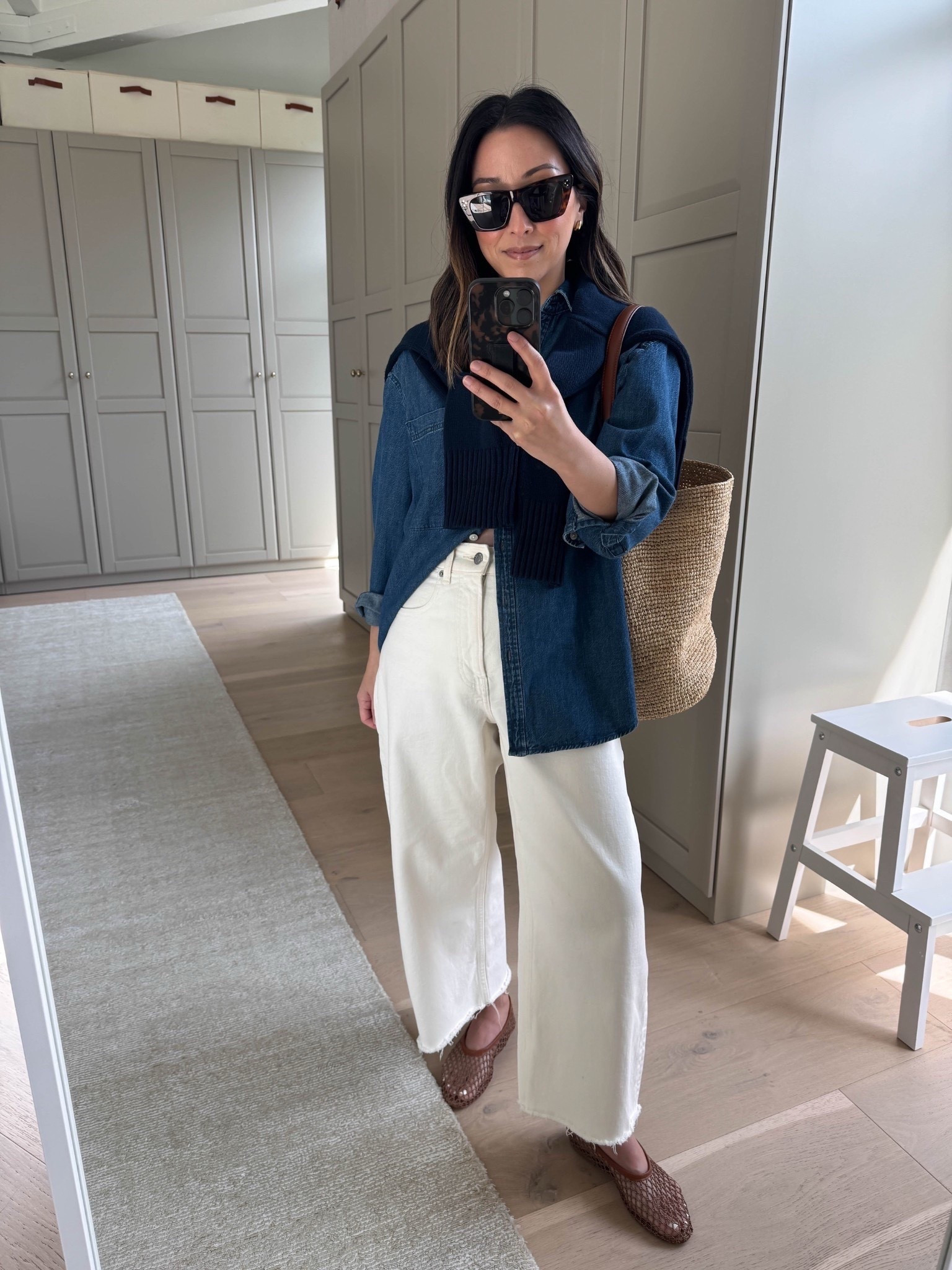 Classic spring outfit idea featuring the best denim shirt- perfectly oversized and the best wash👏🏼 

AYR button down xs
Everlane curve Jean 26 - sized up and cut hems. 
Staud netted flats 35
Everlane cottons sweater xs
J.crew raffia bag
Dorsey James necklace 15”
Quince earrings
Celine sunglasses 

Spring outfits 2026, spring style, petite style, mom outfits 



#LTKmomlife #LTKootd #LTKPetite