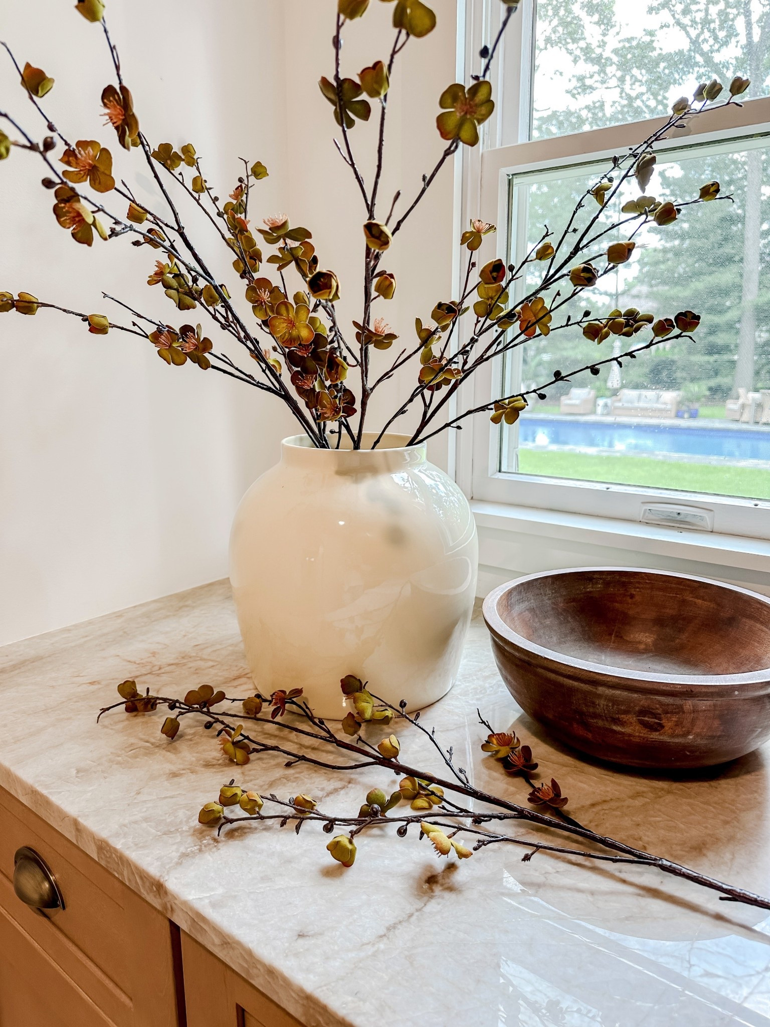 SALE ALERT 🚨 These earthy-colored artificial branches are on final sale. They are just beautiful with its mustard bronze coloring. They look great in my glossy cream vase. Shown: 5 branches.

What I love:
✅ Realistic petals and branch
✅ 40” in height (bend ends to shorten)
✅ The color of the blossoms & vase

#afloral #dreamhouse #apartmenttherapy #colonialchic #homedecor #neutralhome #liketkit #falldecor 



#LTKSeasonal #LTKSaleAlert #LTKHome