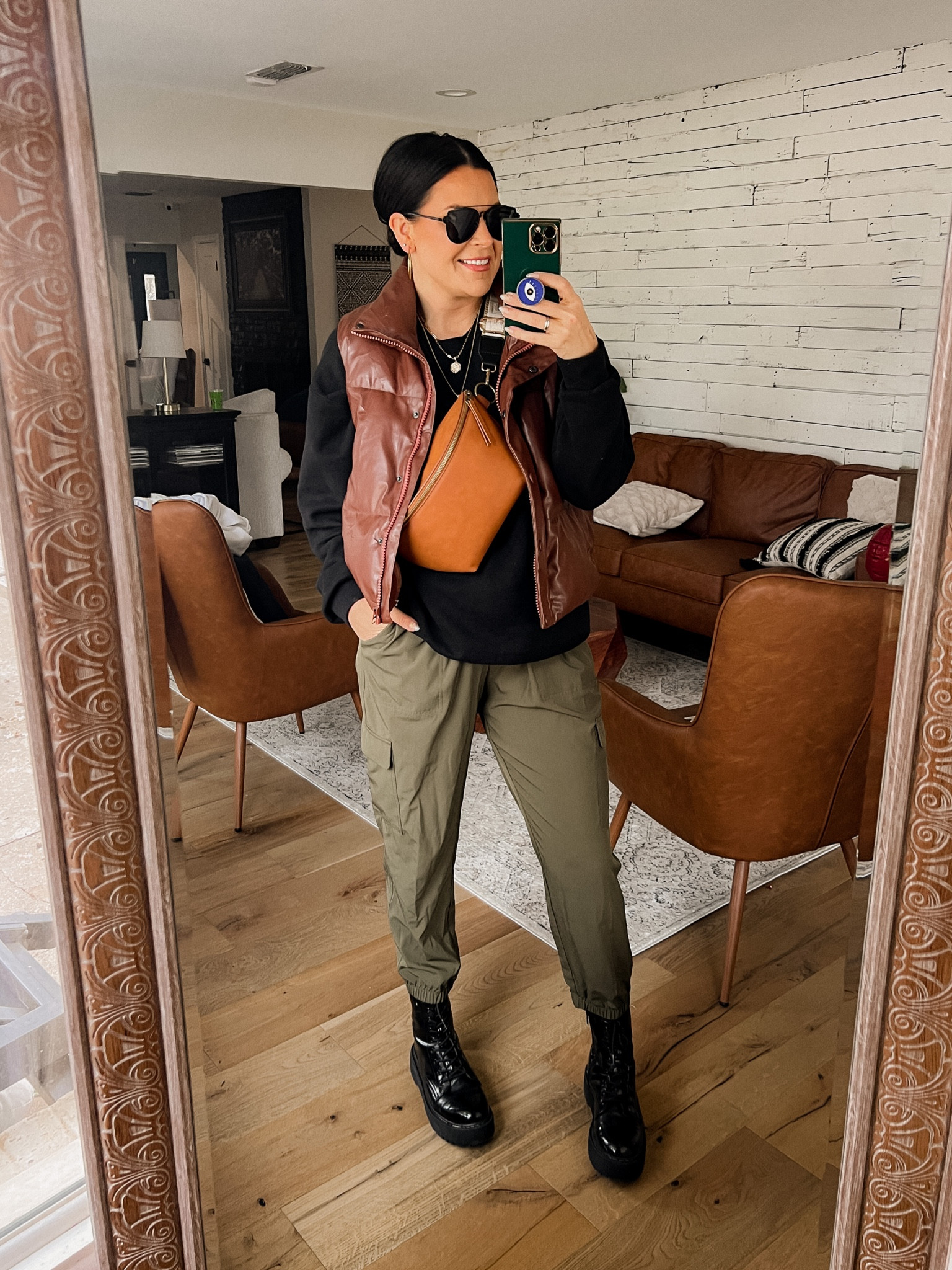 Cargo pants casual outfit. 
Cargo Joggers: Large
Sweatshirt: XL
Faux Leather Vest: Large
Combat Boots: TTS
Bag and strap sold separately 

#LTKsalealert #LTKstyletip #LTKunder50