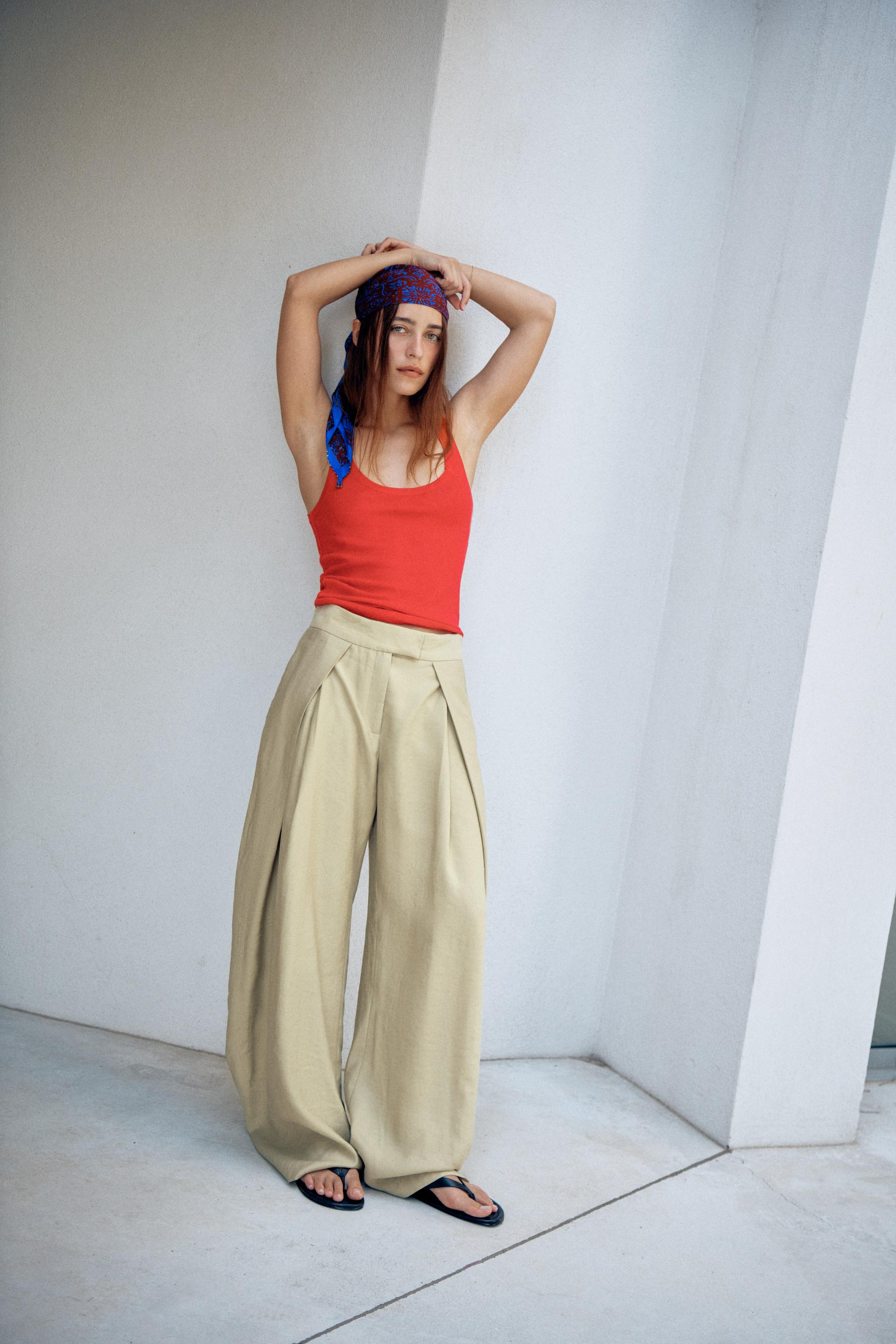 ZARA WOMAN COLLECTIONMid-rise pants made from a lyocell blend yarn. Front pleats. Wide leg. Front... | Zara US