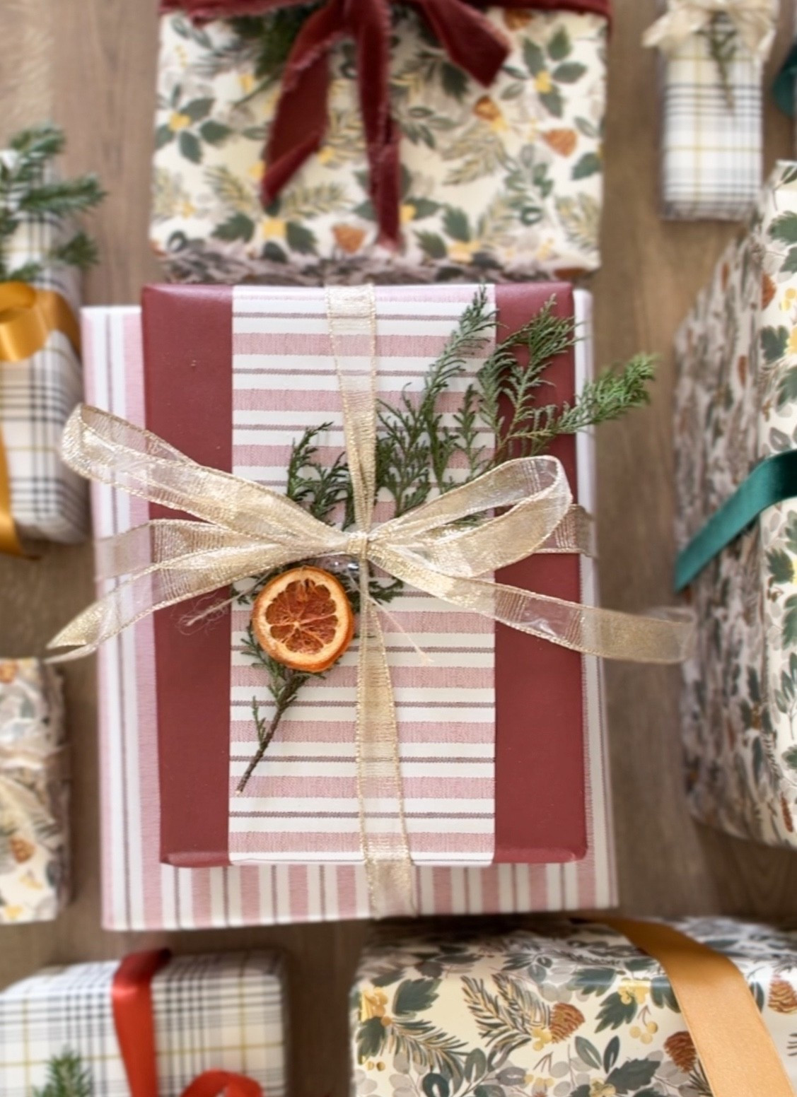 This striped wrapping paper from Walmart is such a beautiful addition to our gift wrap this year. I paired it with a solid crimson paper I found at HomeGoods, and together they feel so classic and festive. 🎁✨ I added live greenery clippings & fried oranges I bought on Amazon as embellishments  

#LTKSeasonal #LTKHoliday #LTKHome