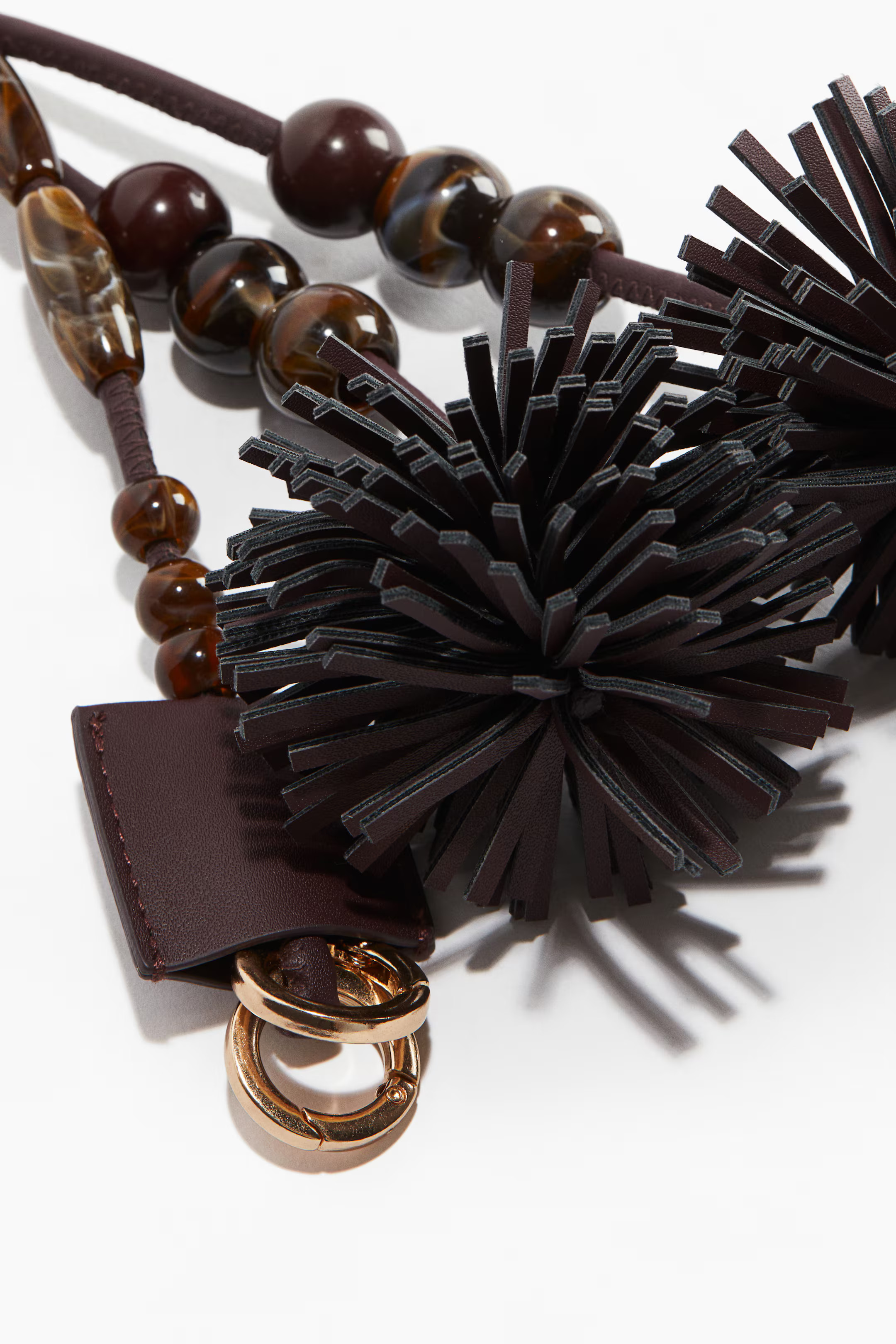 Pompom-detailed bag charm | H&M (UK, MY, IN, SG, PH, TW, HK)
