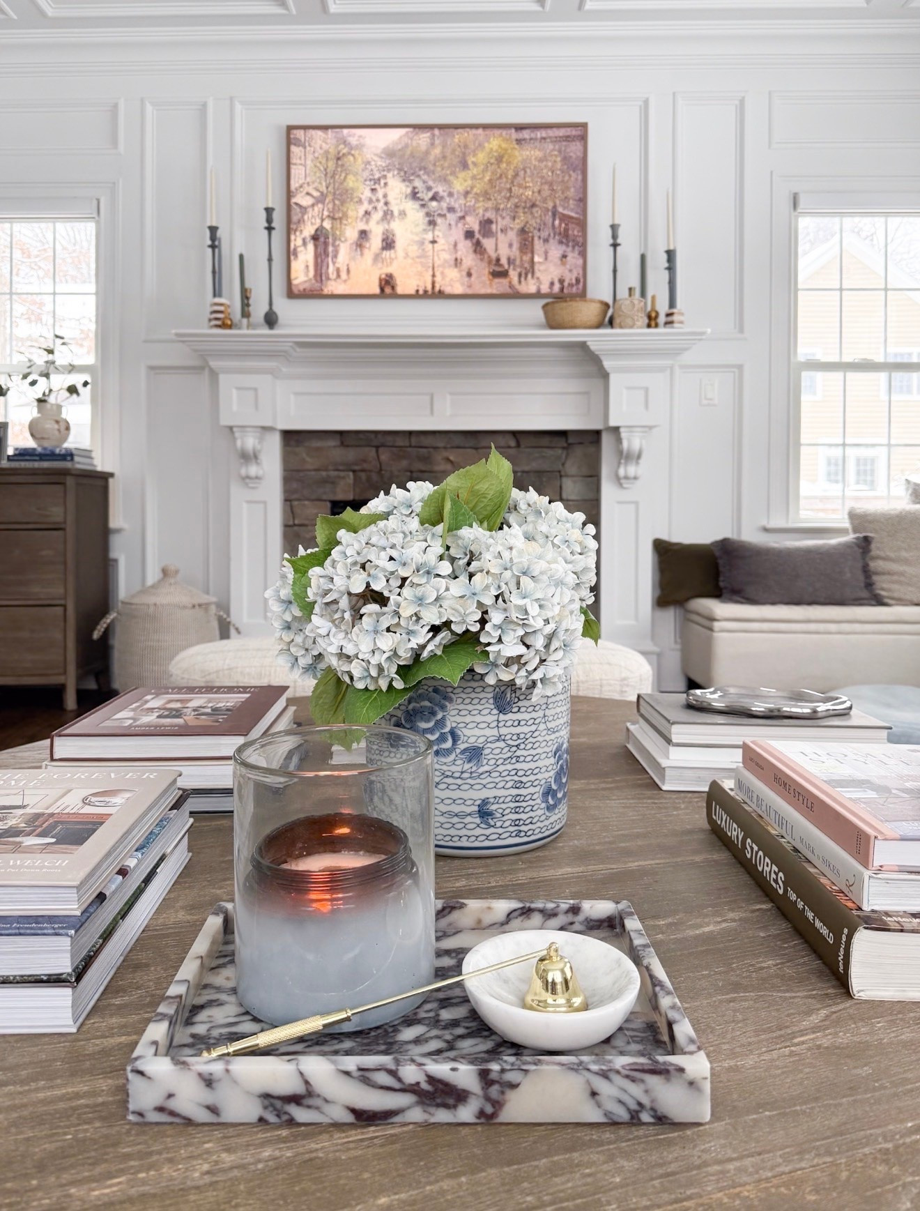 One of my favorite ways to make our living room feel warm and inviting is layering simple timeless pieces throughout the space. Coffee table books, candlelight, marble accents, and fresh hydrangeas instantly create that soft collected feeling I always gravitate toward. I love mixing organic textures with classic blue and white decor to keep everything feeling elevated yet relaxed for everyday living.

living room decor, marble tray styling, blue and white vase, hydrangeas, coffee table books, neutral home decor, layered living room styling, cozy traditional interiors, collected home aesthetic, amazon home finds, Girl on the Hudson

#LTKHome #LTKSeasonal