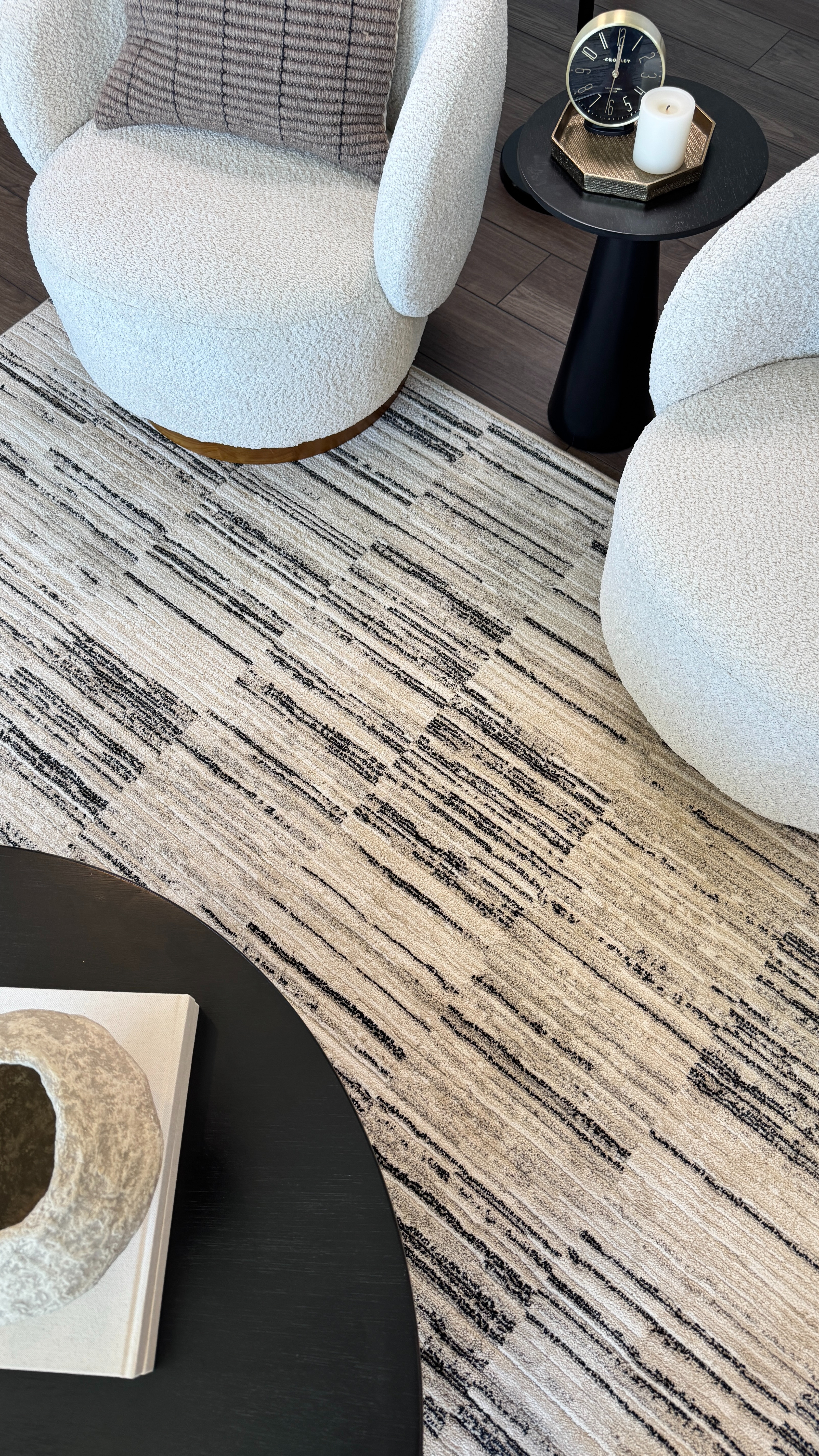 My rug is a top seller 🤍 And for good reason — it works in so many spaces and pairs beautifully with my swivel chairs, black side table, and coffee table to pull the whole room together. 

 #LTKHome