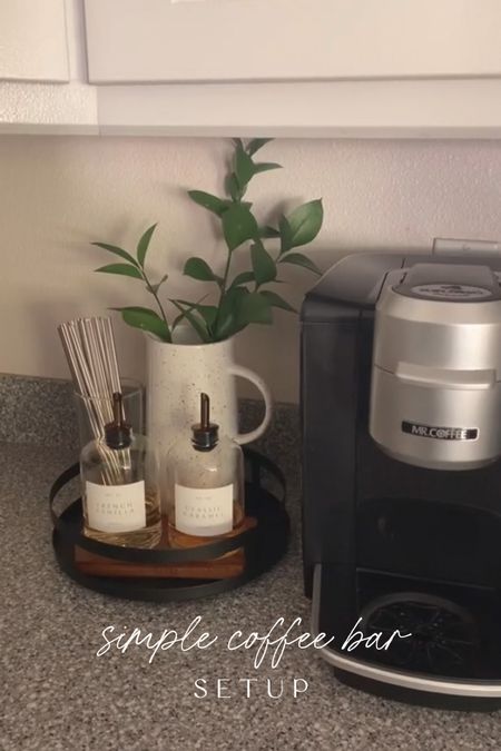 I love to style my coffee bar area so I am always switching things up! Here I’ve got a black metal turntable, glass dispensers for my syrups, cute heart shaped straws and a pitcher that I found at the Target bullseye section to use as a vase. 