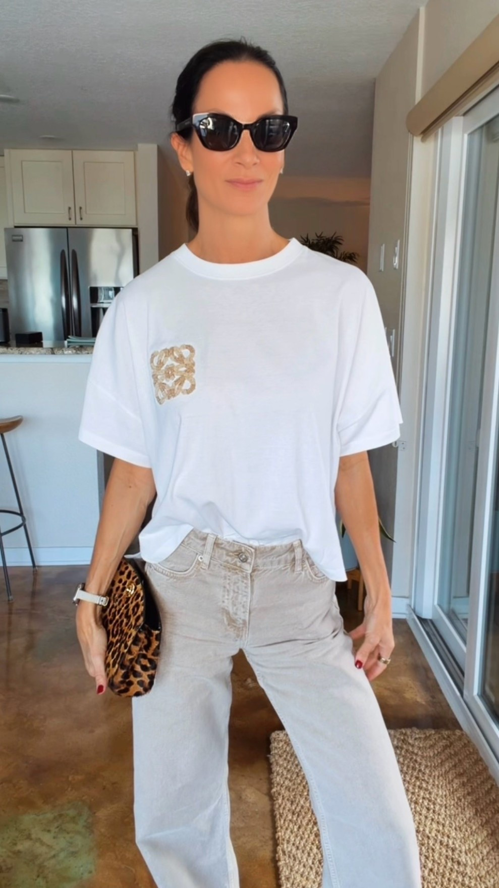 Mahjong with the girls, but you know I’m dressing for the occasion. 😉 Obsessed with the washed sandy color of these wide-leg jeans! Styled with a white Loewe logo tee, Celine cage sandals, Dior sunglasses and a leopard clutch for a little attitude. An easy jeans-and-tee outfit with accessories that do the most. 🤎

#LTKdayinmylife #LTKgrwm #LTKootd