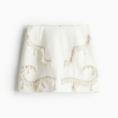 Pearl detail ivory mini skirt 

#LTKstyletip #LTKSeasonal #LTKfindsunder100