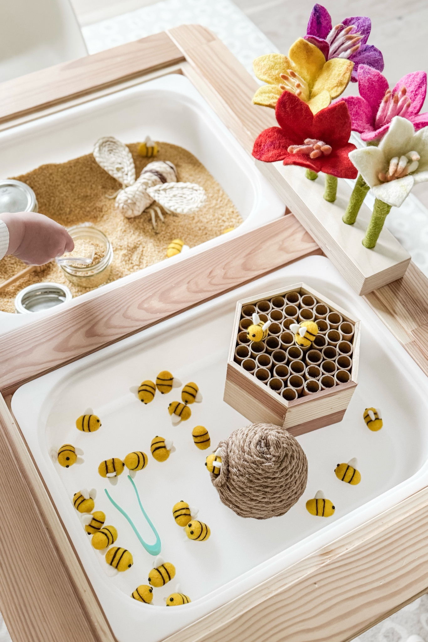 Some bee play with our #LTKToddler . 

The exact bee hotel and large raffia “queen” bee are from a past Bullseye’s Playground Dollar Spot at Target. 🐝🍯 

Additionally, I pulled the decorative bow and bees off from the woven hive. 🤭

#LTKKids