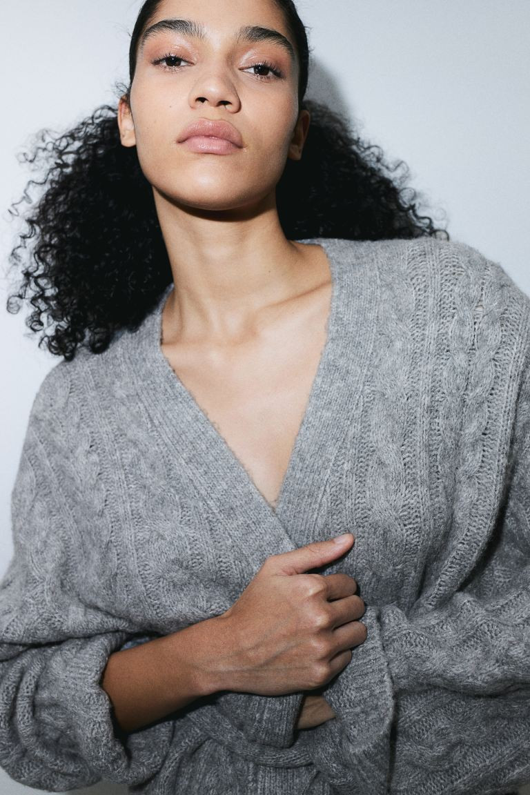 Kabelgebreid vest met strikceintuur | H&M (DE, AT, CH, NL, FI)