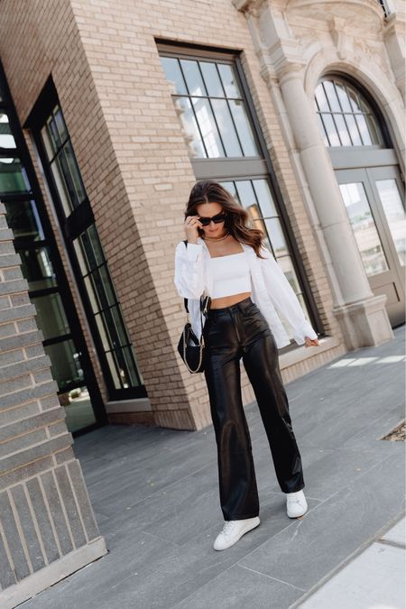 We love a classic black & white outfit! I’m wearing a size S in the top & button up & a 25R in the leather pants. My sneakers run TTS. // spring outfit, neutral outfit, leather pants 