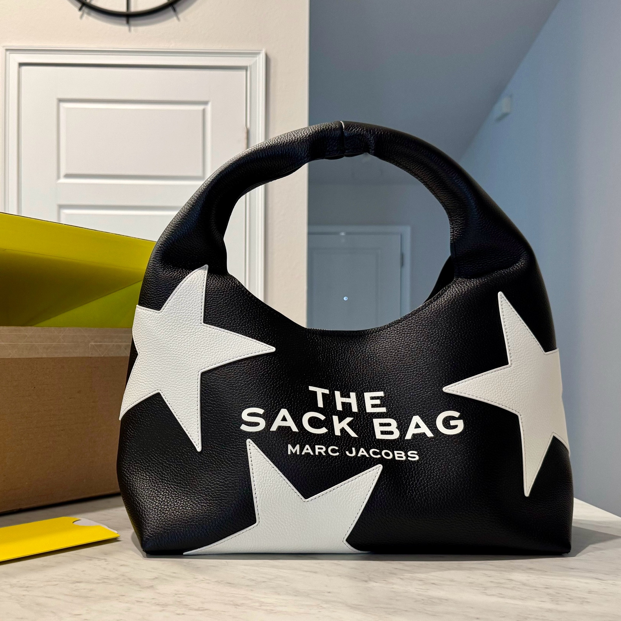 The Marc Jacobs Star Sack Bag is my new go-to accessory! Its unique, soft structure makes it comfortable to carry, and the spacious interior is perfect for holding all my daily essentials. The eye-catching star design adds a fun, playful touch that makes it a statement piece. You’ll love how effortlessly it elevates any outfit! ⭐️

#LTKStyleTip #LTKItBag