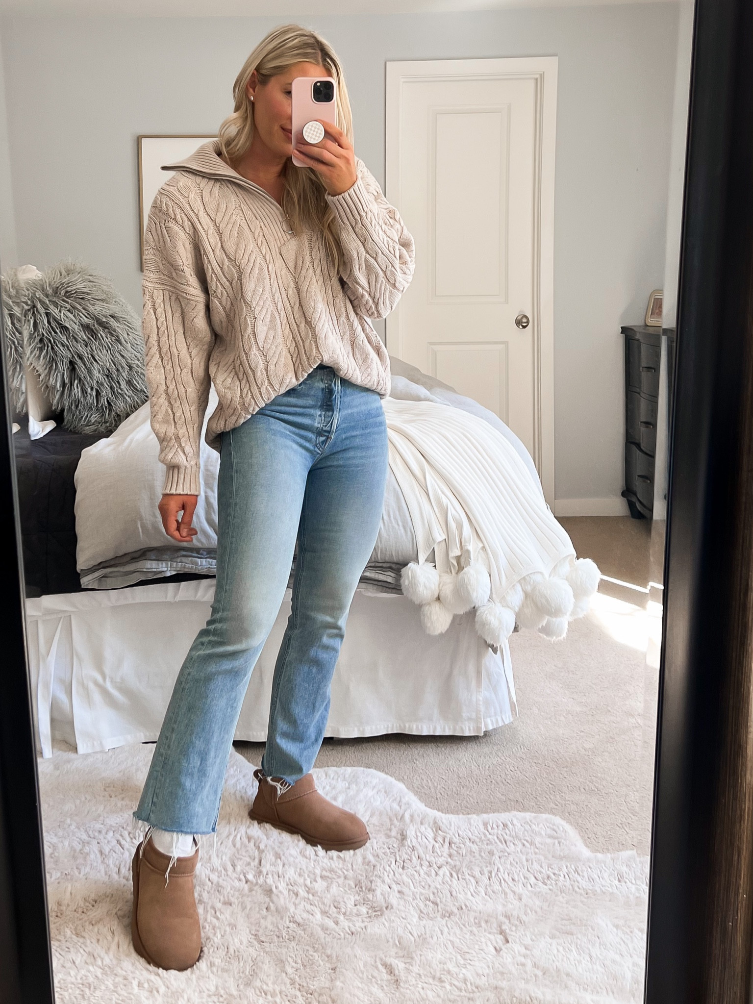 Styling ultra mini Uggs with jeans and a sweater. 

#LTKfindsunder100 #LTKover40 #LTKstyletip