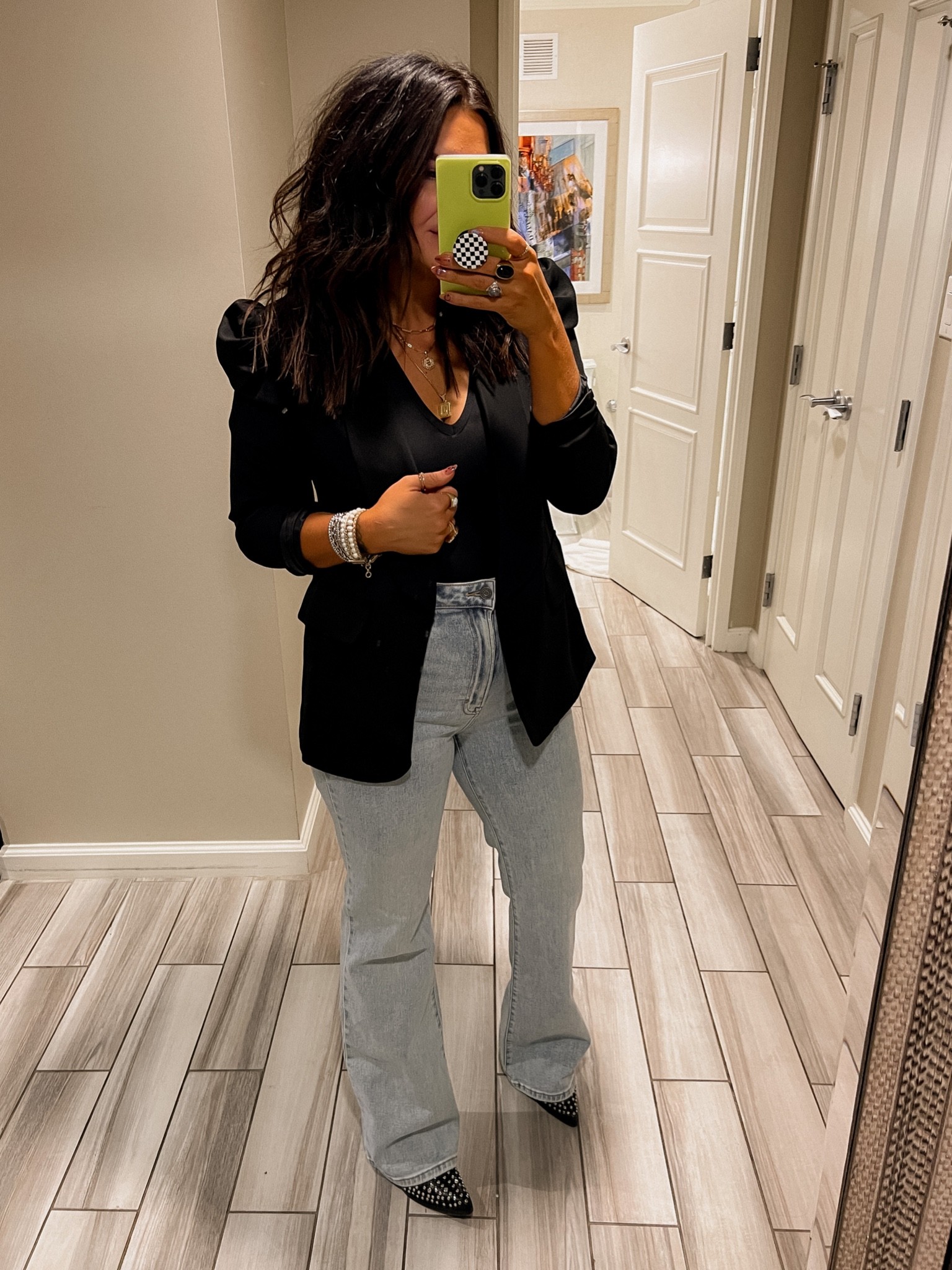 Puff sleeve Amazon black blazer
Blazer: Large
Bodysuit: Large
Jeans and boots are Vici. 
