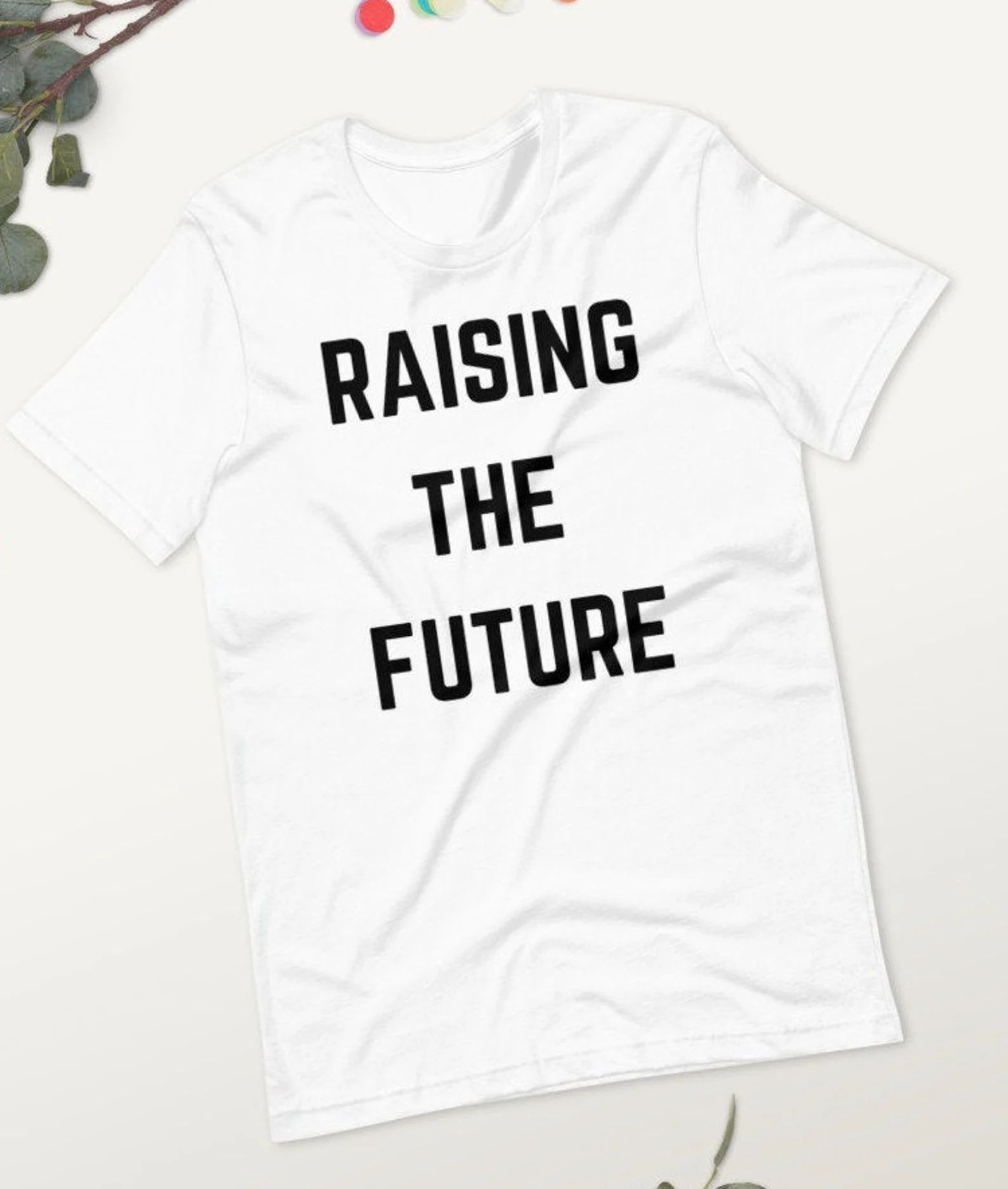 Read the full title
    RAISING THE FUTURE | Empowered | Short-Sleeve Unisex T-Shirt | Etsy (US)