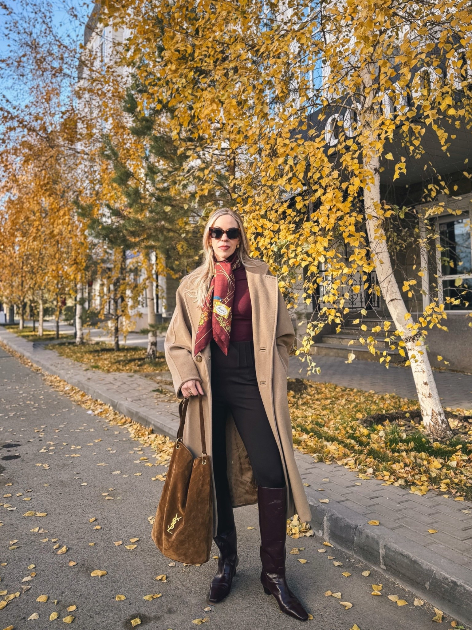 Camel coat fall outfit, burgundy silk scarf, brown leggings with tall boots, burgundy boots outfit