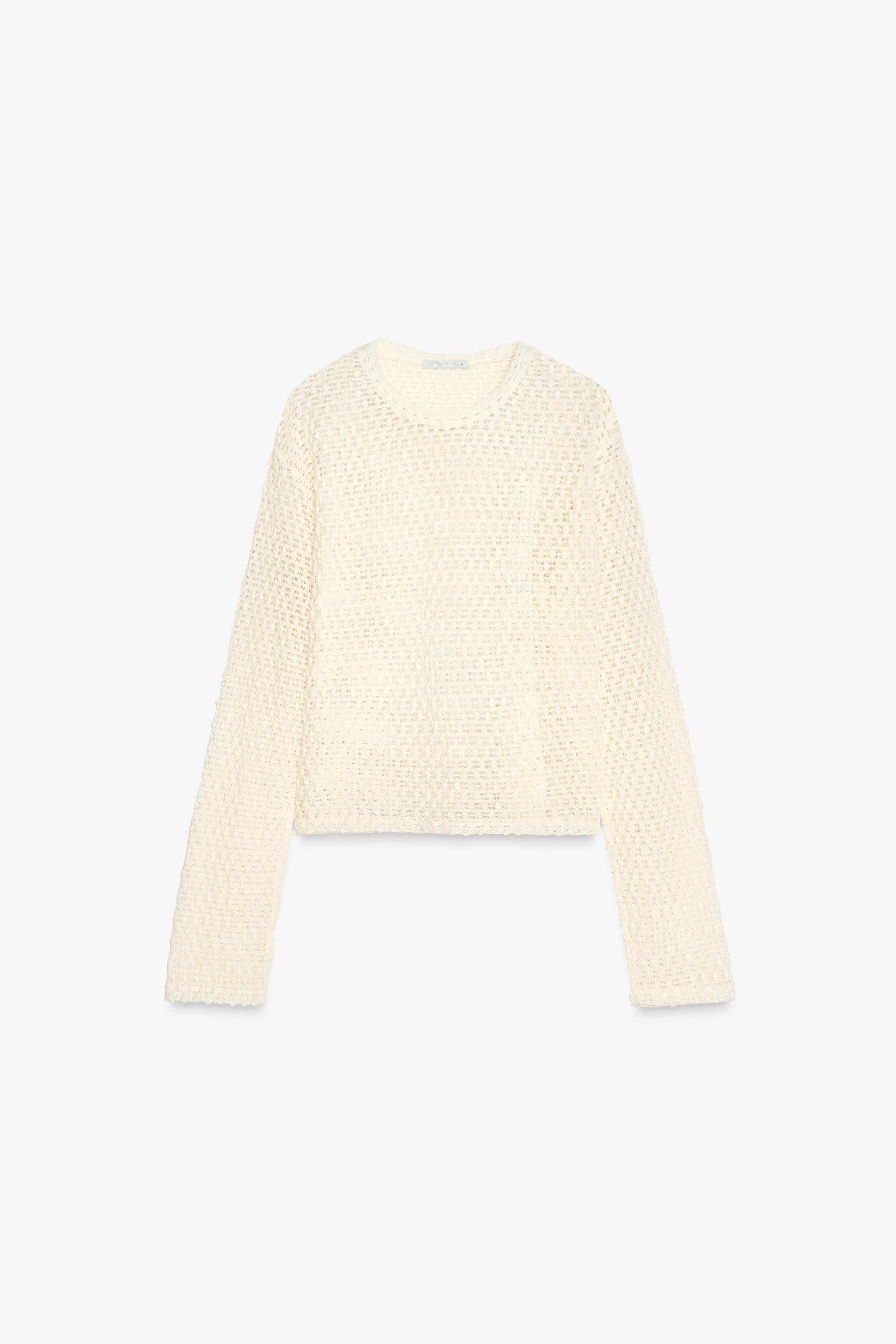 Round neck, long sleeve top. Perforated fabric detail. Straight hem. | Zara UK
