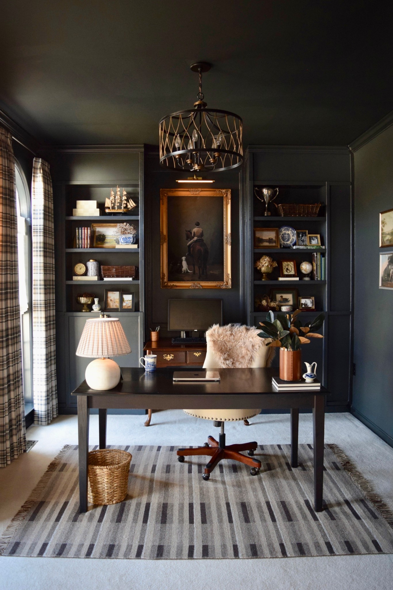 Over the Moon for Our Ralph Lauren, English Country Inspired Home Office Makeover!
Featuring these classic plaid drapes, natural woven shades, and decorative curtain rods from @twopagescurtains!  
Use code Onassisandclaire for 24% off

#twopageshome  #twopagescurtains 
 
Window Treatment Details:

Sara Le Print Linen Drapery
–Latte SL-E5
–Triple Pleat
–Privacy Liner
–Memory Shaped
 
Arno Single Decorative Curtain Rod with Rings
–Color: Black
–Finial:  Ellipse
 
Rae Natural Ramie Flax Woven Wood Shades – Series C
– Color: Ivory C14
– Inside mount
– Cordless

#LTKHome #LTKWorkwear #LTKMens