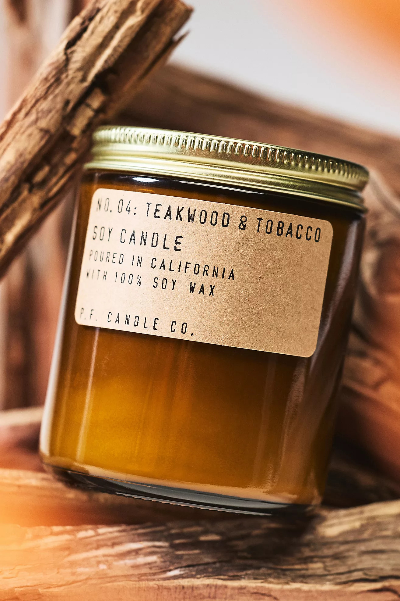 P.F. Candle Co. Woody Teakwood & Tobacco Glass Candle | Anthropologie (US)
