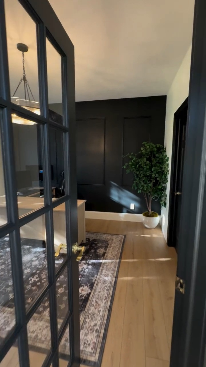 ✨ Before ➡️ After ✨
Our home office transformation is finally complete! We went bold with an accent wall, paired it with warm white oak flooring, and added sleek black accents for contrast. The door got a dramatic upgrade too — painted in Greenblack by @sherwinwilliams 💚🖤 Floors are @coretecfloors by @shawfloors 

This space is now equal parts cozy and inspiring — exactly what we dreamed of for our work-from-home sanctuary.  @wayfaircreators @wayfair #Wayfair #wayfaircreator

#HomeOfficeGoals #BeforeAndAfter #AccentWall #SherwinWilliams #HomeInspo #OfficeDesign
#homeofficeinspo #interiordesign #officegoals #darkinteriors #interiorstyle #interiorinspo #homeworkspace #designerhome  #interiorarchitecture #collectedhome #homeofficedesign #workspaceinspo #wfh #homeoffice #office #officedesign #homeofficegoals #officegoals #workfromhome #modernhome #officeinspo #designbuild #designbuildfirm