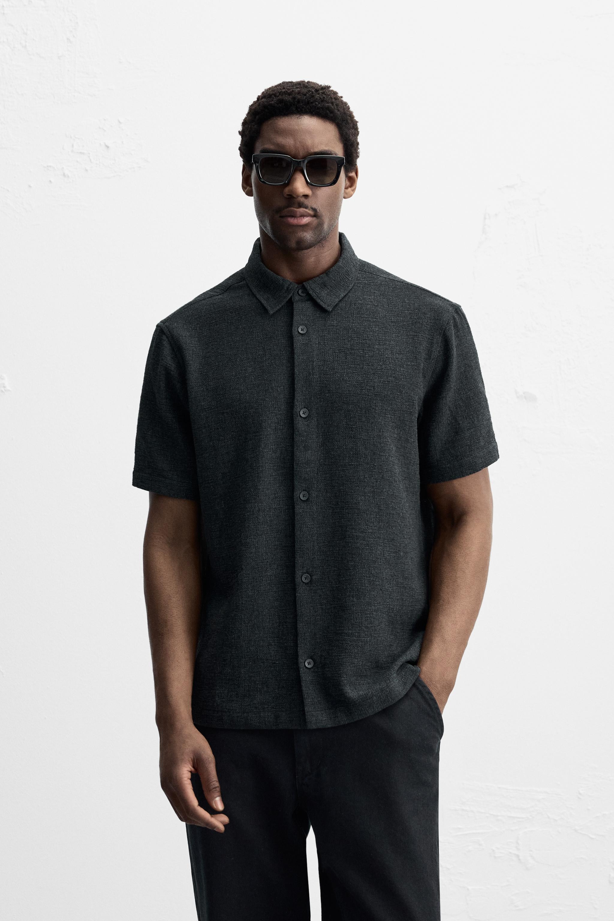 Relaxed fit shirt made of cotton blend fabric. Lapel collar and short sleeves. Side vents at hem.... | Zara US