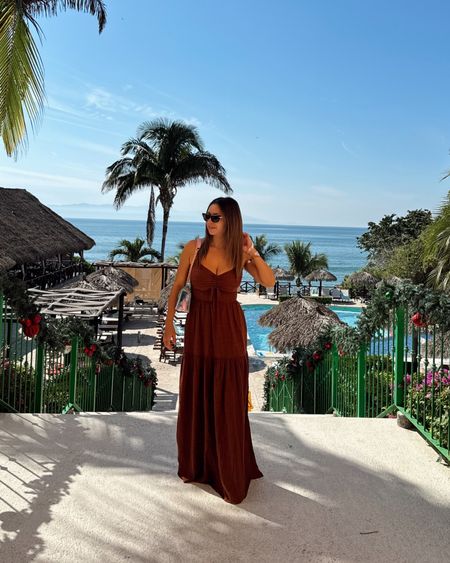 Love this summer dress for beach vacations! It comes in 3 colors and the length works on me with flats even though I’m only 5’1. 
Wearing size small

Beach outfit, vacation outfit, resort wear, beach dress, summer dress, maxi dress, brown dress, petite, travel

#LTKSeasonal #LTKStyleTip #LTKSwim