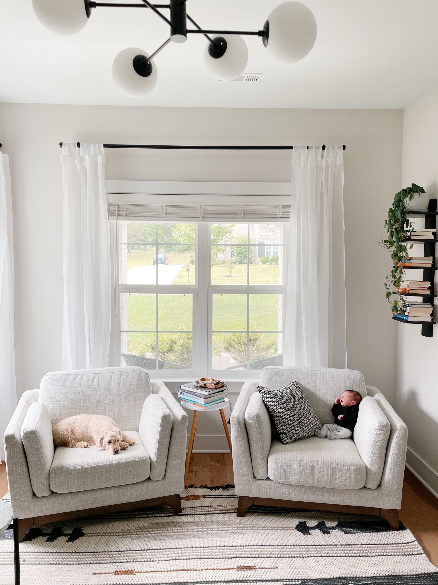 Home decor, area rug, neutral rug, accent chairs, book shelf, wall book shelf, side table 

#LTKhome
