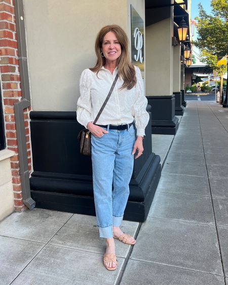Here's a comfy vacation outfit that I wore for my trip to Napa! An embroidered white button down with cuffed jeans and neutral slides. I am wearing size small top, 2P jeans and 6.5 shoes. All are true to size.
#traveloutfit #modeststyle #springfashion #capsulewardrobe

#LTKShoeCrush #LTKTravel #LTKSeasonal
