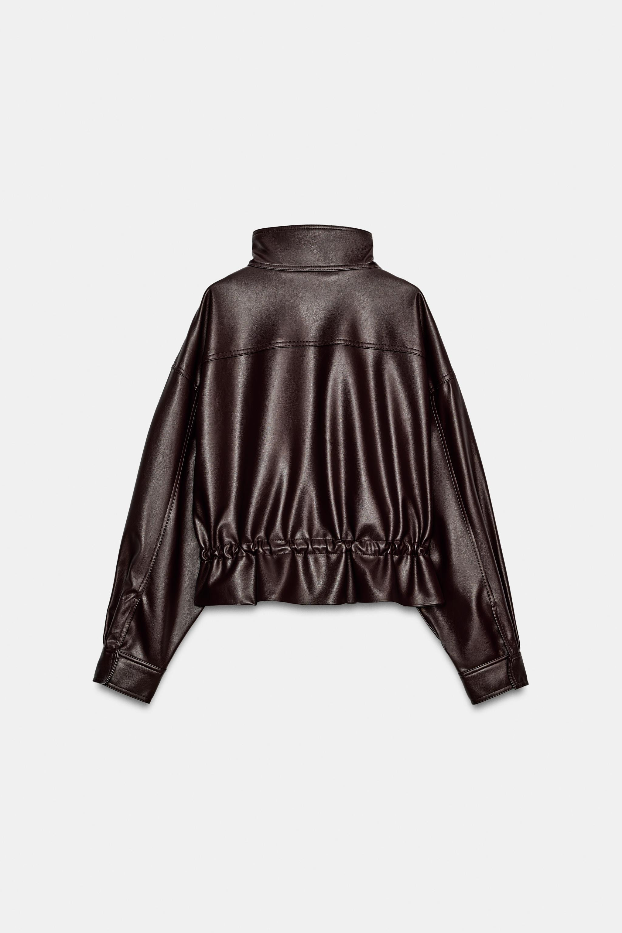 High-neck jacket with long drop-shoulder sleeves. Adjustable waist with drawstrings. Welt pockets... | Zara US