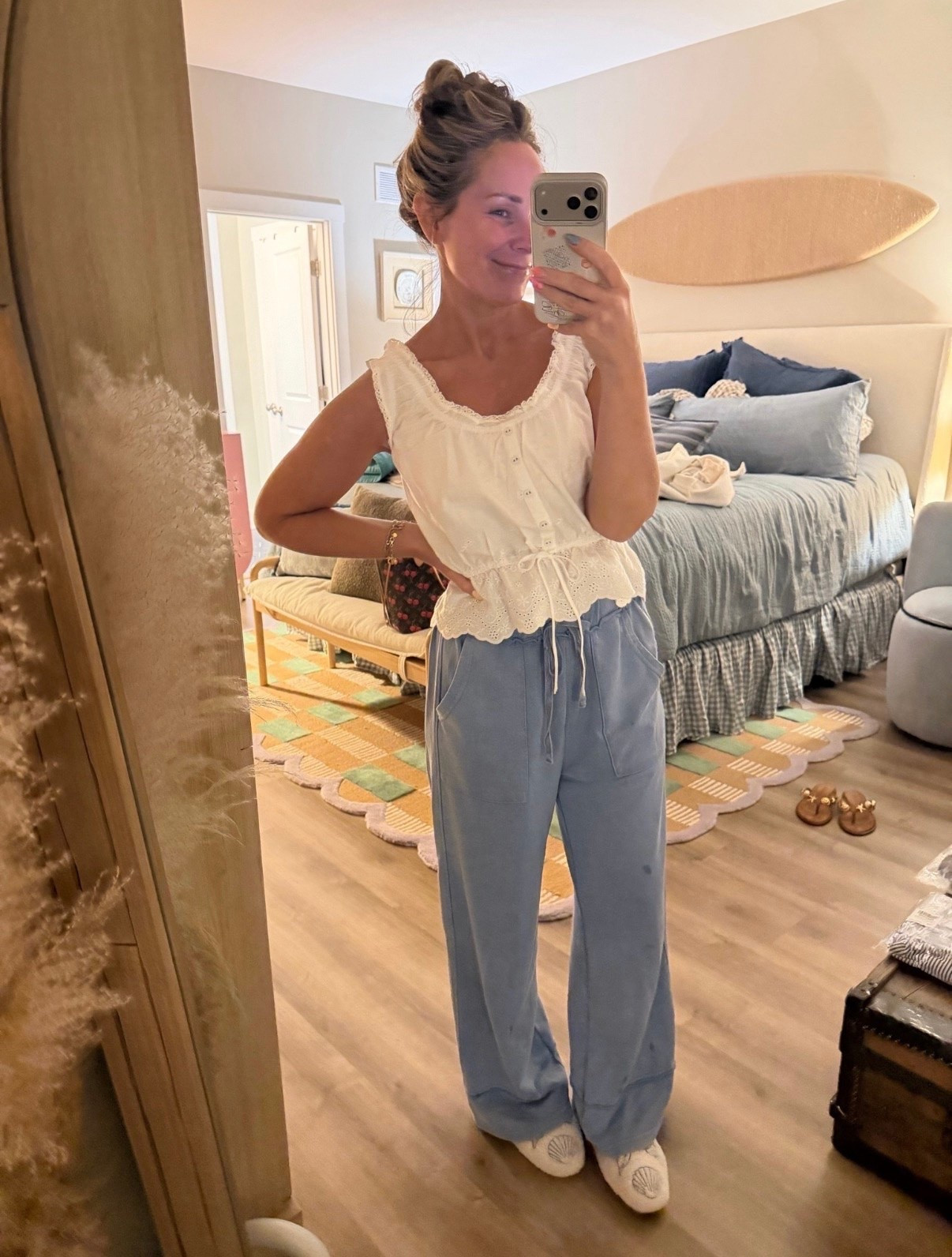 The kind of outfit that feels like pajamas but still looks put together. ☁️🩵

These dreamy blue pants are unbelievably soft, and paired with this feminine eyelet top, it’s the perfect mix of comfy and cute. Whether you’re running errands, grabbing coffee, or working from home, this is one of those outfits you’ll reach for again and again.

Everything is linked in my LTK! 🤍✨