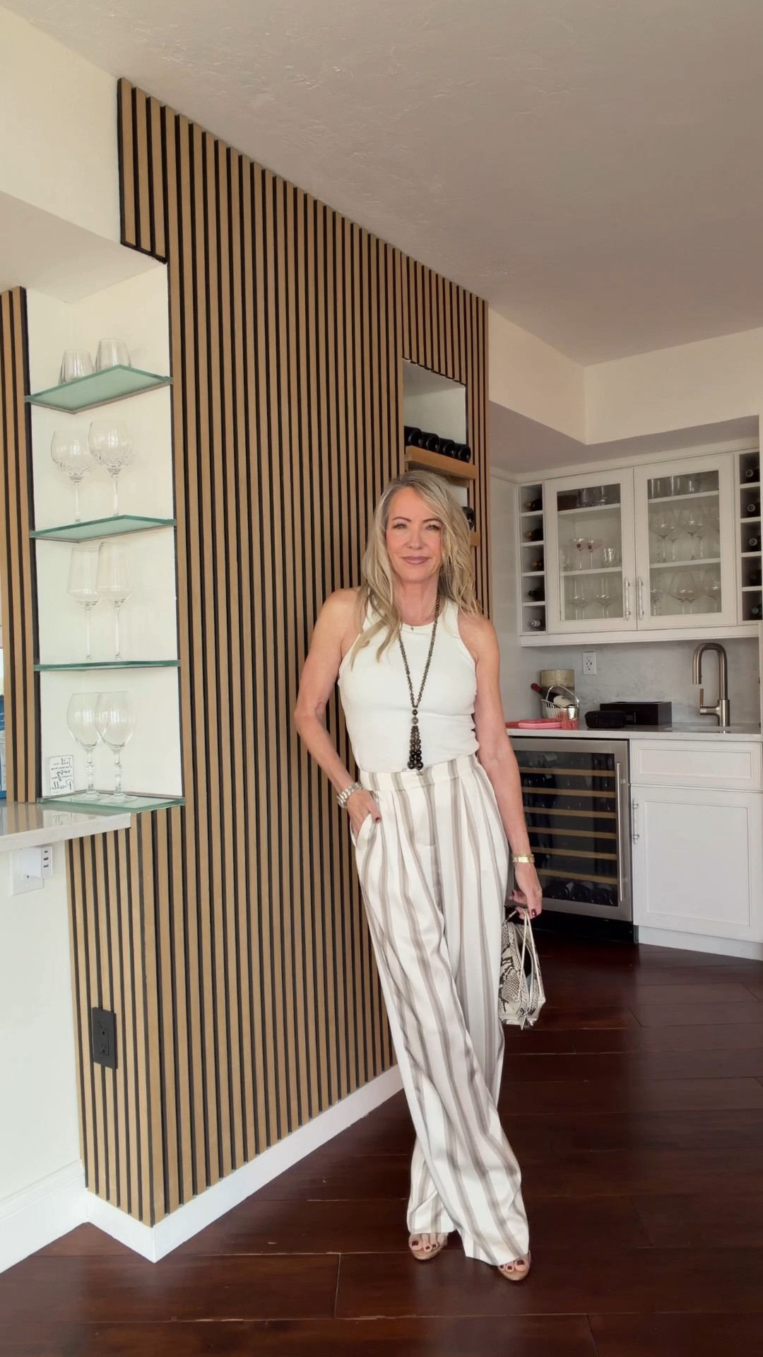 Effortless chic at 58! A simple white tank paired with flattering, wide-leg striped trousers is my idea of understated elegance. Add a statement necklace and a chic handbag for an easy, polished look that works from lunch to dinner. Classic pieces you’ll wear on repeat!

#LTKOver50 #PetiteStyle #QuietLuxury #StyleOver50 #EffortlessChic