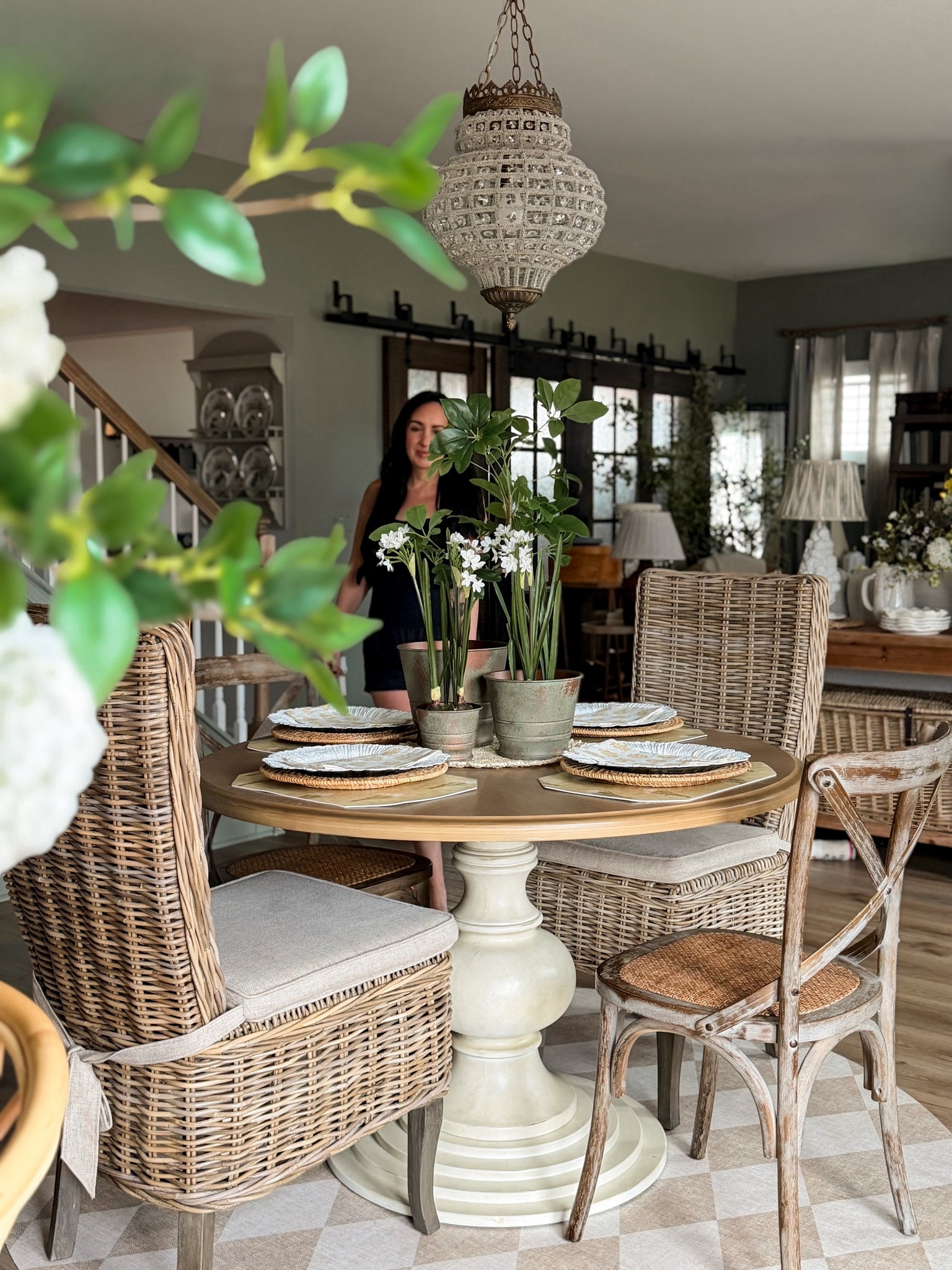 A little Tuesday refresh in our breakfast nook.

Spring here is never a full makeover. It is a simple layering of pieces | already love. Faux greens & soft white florals in aged pots. Wicker, warm wood, & natural light doing what they always do in this space.

The best part is in the details. The placemats were thrifted for one dollar each. The linen napkins were a clearance find at Pottery Barn last fall while I was in store shopping. Timeless pieces at thoughtful prices will always be my favorite way to build a table that feels collected rather than rushed. Dining table, chairs & chandelier are from my friends at @antiquefarmhouse & the round mat is from my friends at @vmathome

Florals & greenery are not just seasonal decor for me. They are part of my everyday cottage style. I always want our home to feel lived in, layered, & gently evolving as the seasons shift.

Sometimes a spring update is simply a few stems & intention. xo, Krystle - Spring countdown: 17 days ☀️🫶🏼🤍

#LTKHome #LTKSpringSale #LTKSeasonal