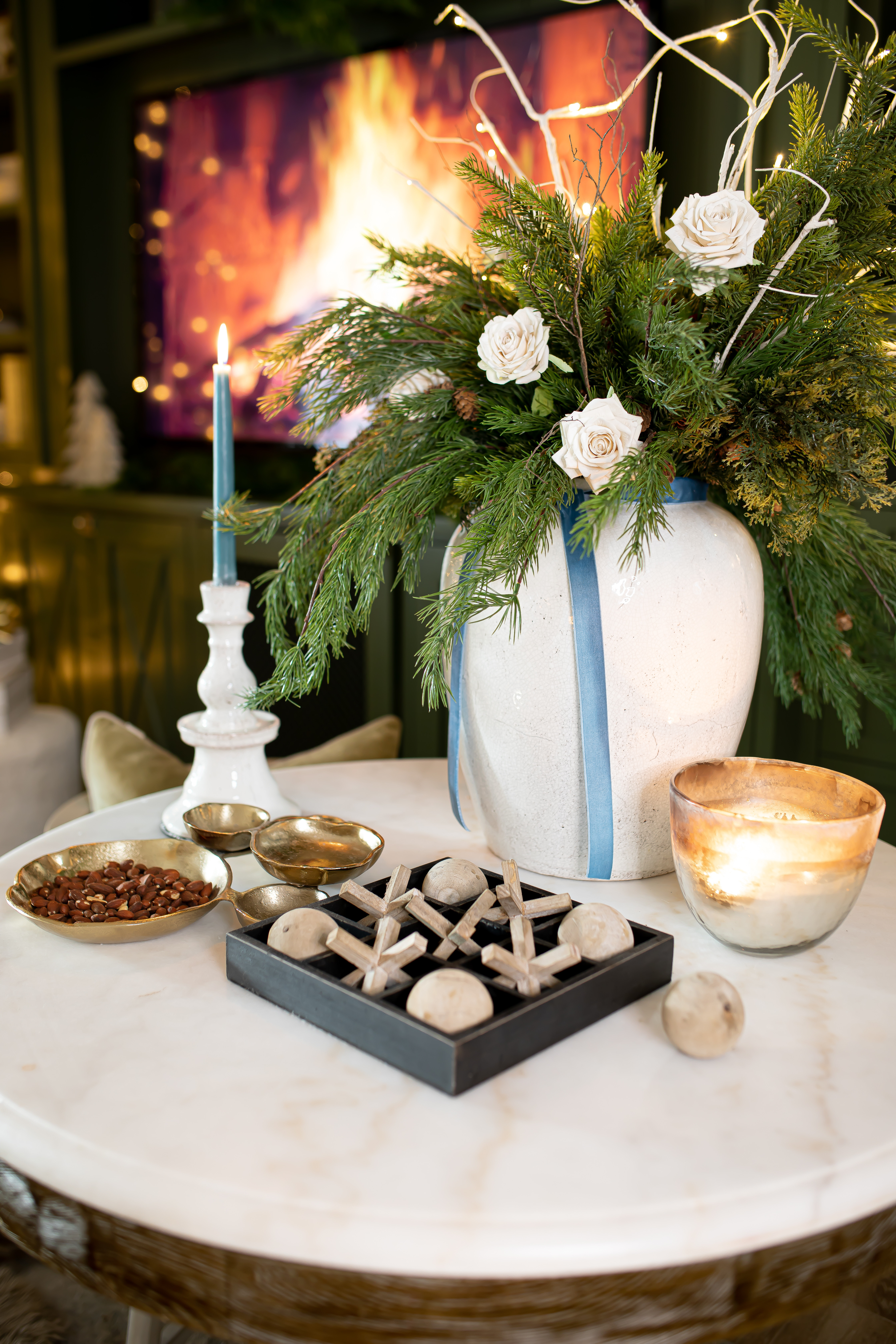 Christmas decor closeup!
One of my favorite looks I created with some cedar stems, white roses and a favorite Arhaus vase! 

Linking so you can recreate this look

#LTKSeasonal #LTKHome