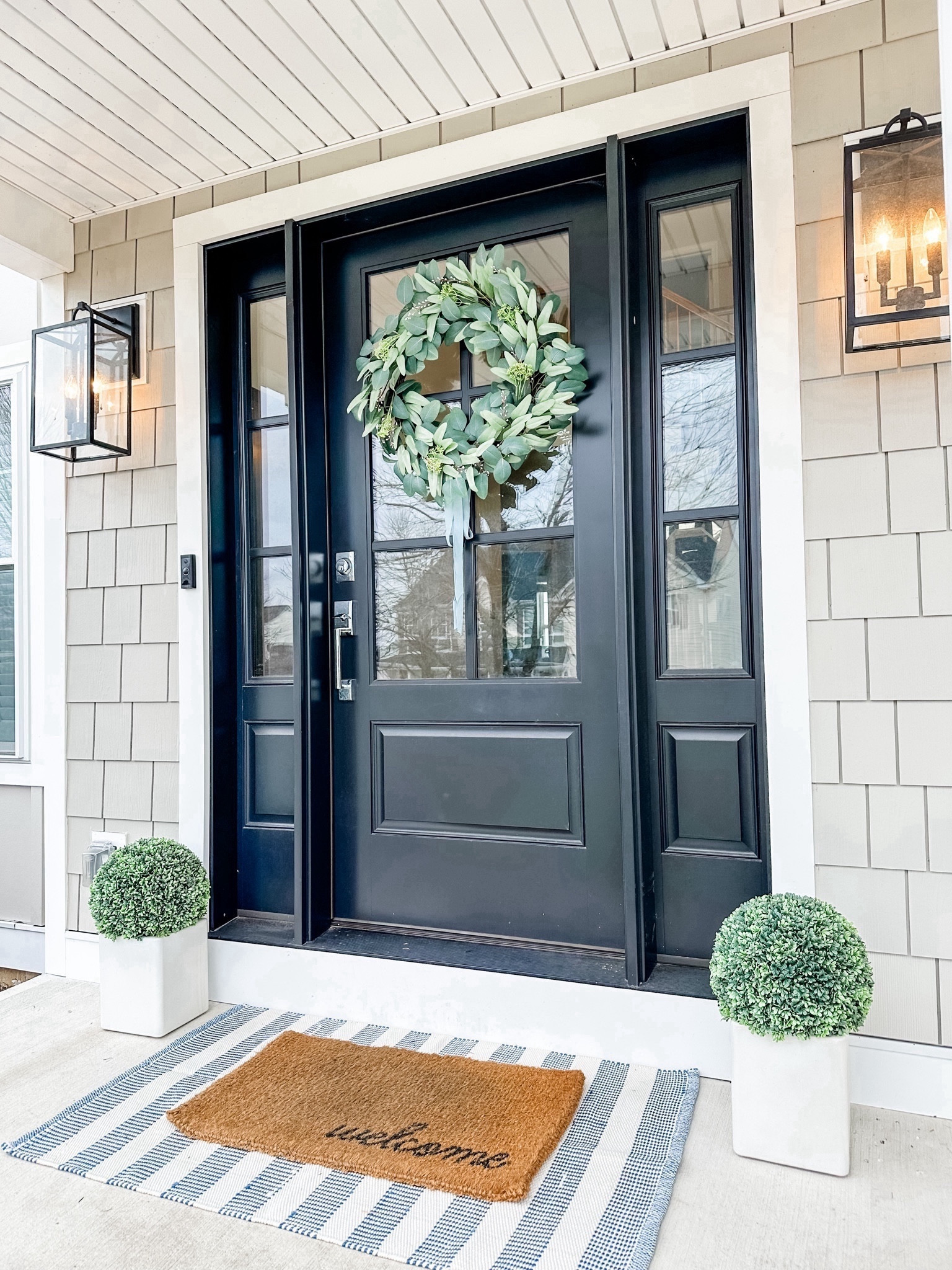 Refreshed my front door for spring and now can’t wait for warmer weather to add some potted flowers. I used a 2’6”x 4’2” rug under a 1’6”x 2’6” doormat. Love this new Target Studio McGee eucalyptus wreath with blue ribbon! 💙

Spring front door decor, Spring porch decor, Spring refresh, transitional porch, coastal porch, coastal decor, beach house decor, beach decor, coastal home decor, coastal decorating, coastal interiors, coastal house decor, beach style, neutral home decor, modern traditional, traditional home decor, coastal hamptons Nantucket home decor, classic, timeless, blue & white home decor, grandmillennial, coastal grandmother, blue outdoor rug, layered doormat, boxwood topiaries

#LTKhome #LTKstyletip #LTKfindsunder50