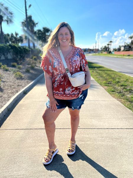 Beachy Plus Size OOTD. I'm wearing a top from Walmart in a size 2x, a pair or distressed denim shorts from Eloquii in a size 20, a pair of sandals from Target and a belt bag from Lane Bryant! 

#LTKcurves #LTKstyletip #LTKunder50