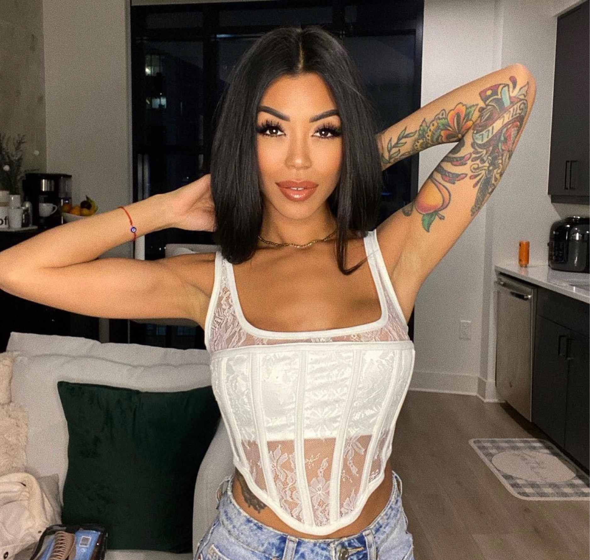 Loving this elegant Meshki lace corset top. I paired it with boyfriend jeans from Zara and white heels.