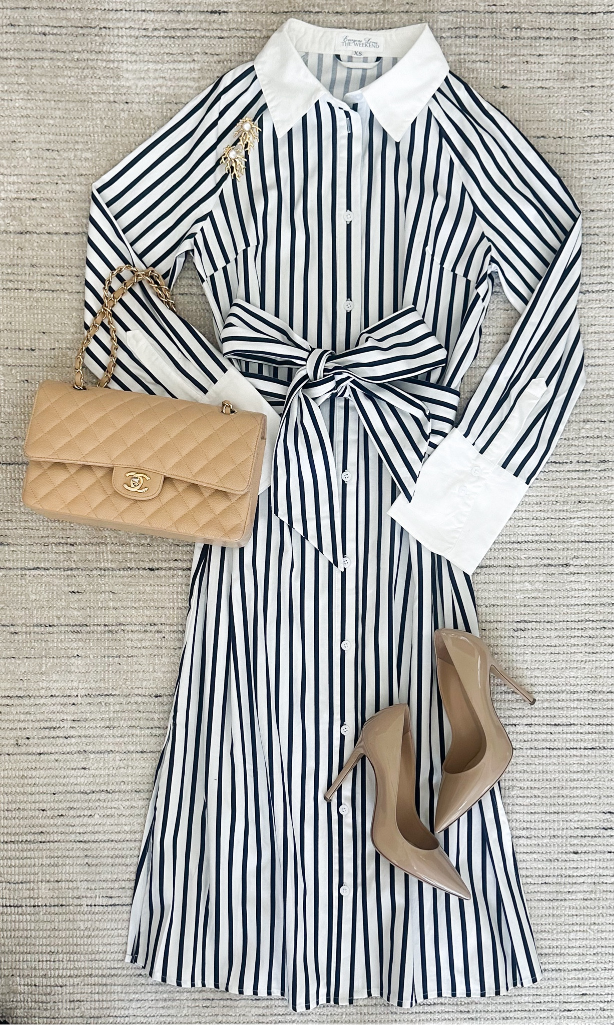 Striped midi dress that has button closure down the front, shirt collar, tie waist and super flattering on. Paired it with pumps for a chic look. Perfect for fall workwear or dinners. Can be dressed more casual with sneakers

#LTKStyleTip #LTKSeasonal #LTKWorkwear